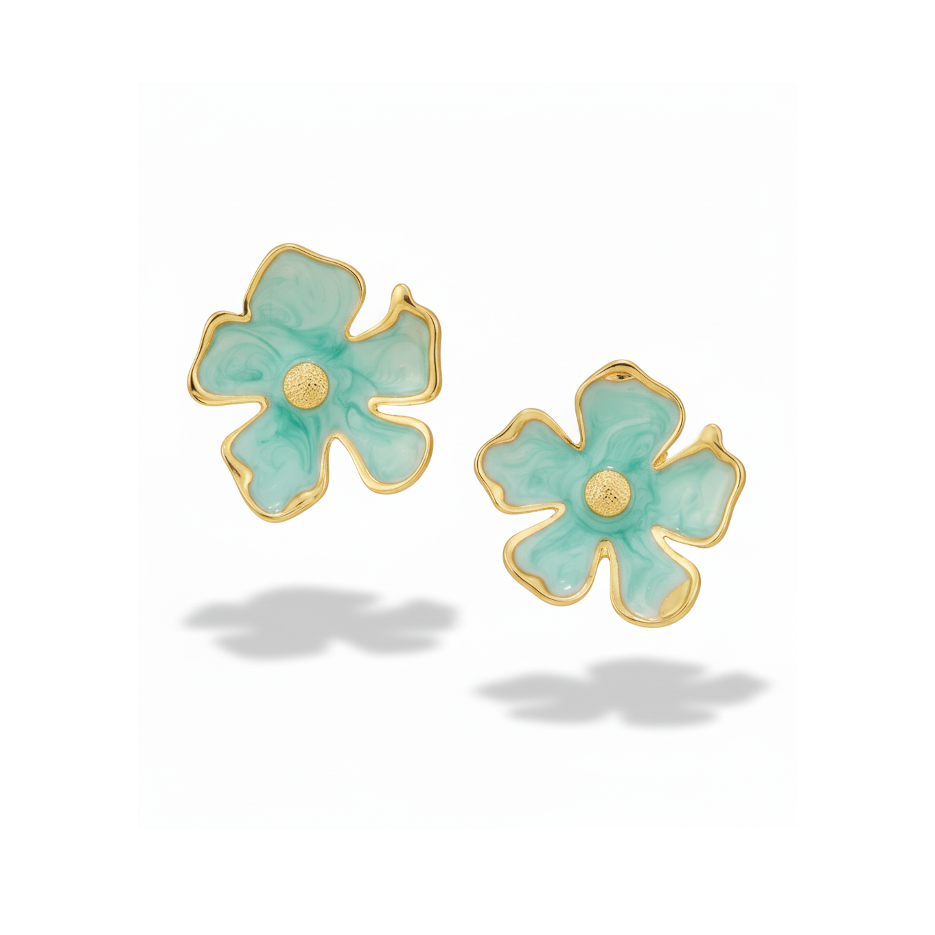 Infuse your jewelry curation with a fresh, playful charm. These beautiful flower stud earrings break away from rigid geometry, embracing a highly fluid, organic petal profile that celebrates an out of the box standout design. The true beauty is in its unevenness, mimicking the natural, sweeping curves of a blooming flower. Each piece features a rich, textured enamel inlay accented by a high polish gold frame and a textured center pistil, creating a perfect balance of soft color and bright metallic sheen.
