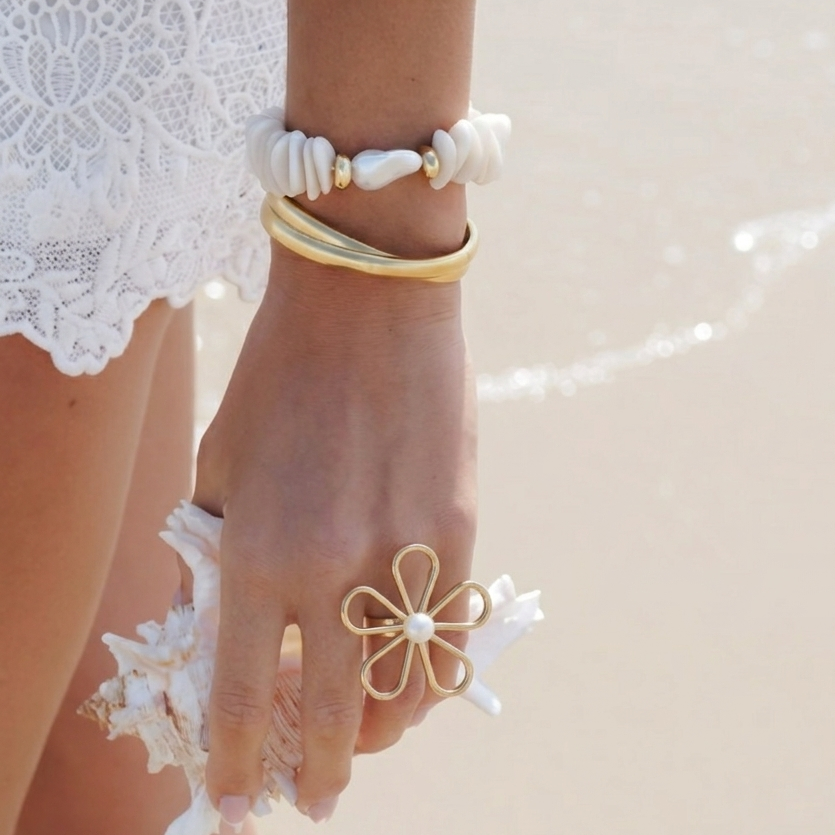     Contemporary floral statement ring displayed against a white background.