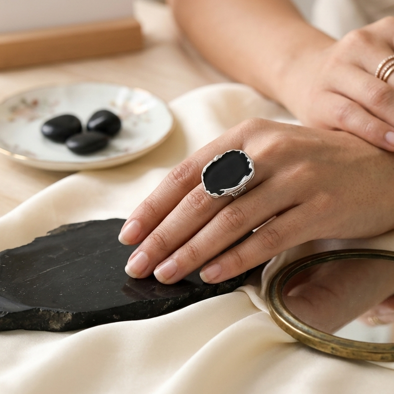     Contemporary geometric black enamel ring crafted with a premium alloy base.