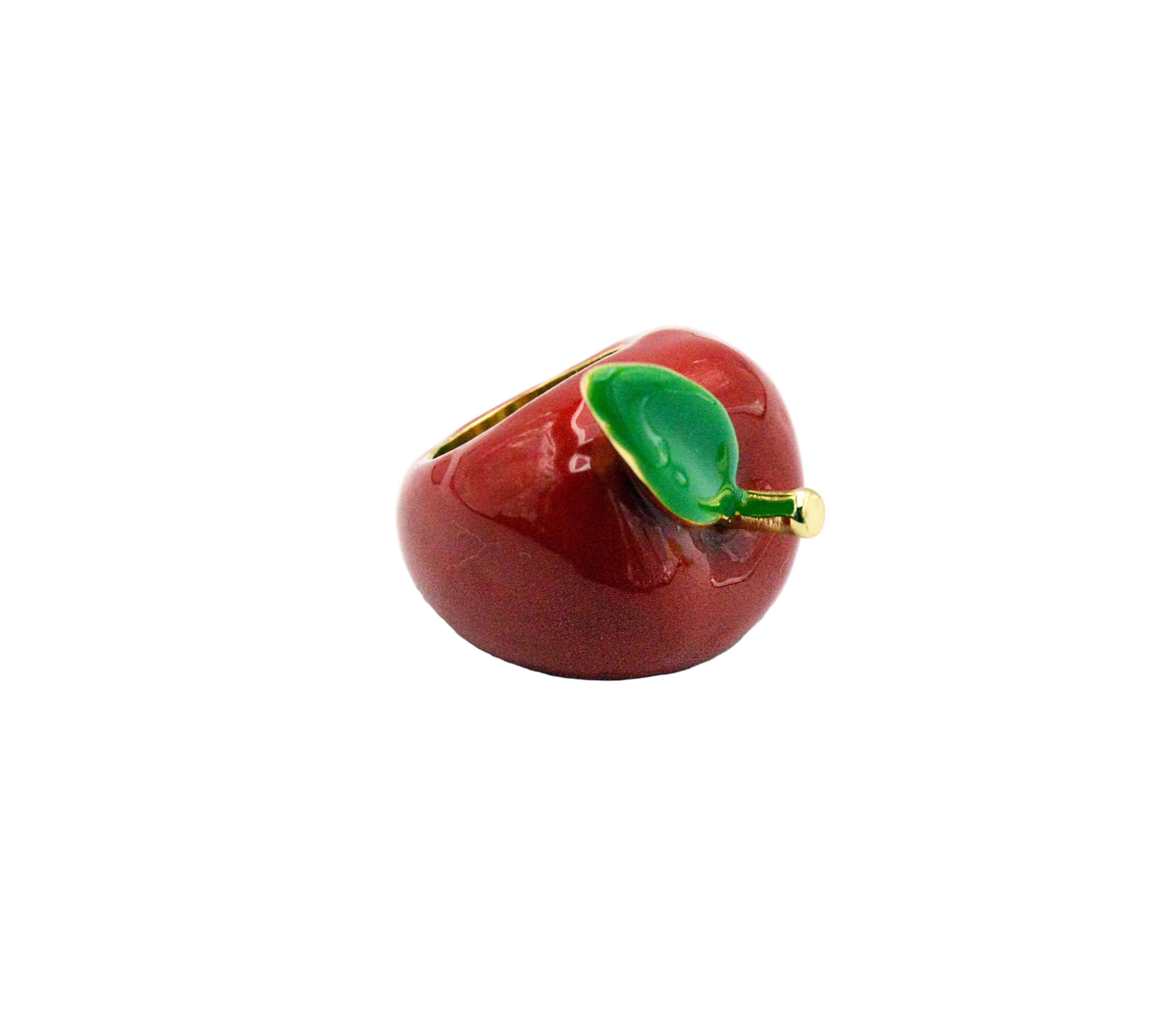 Red apple-shaped container with a green leaf on a white background
