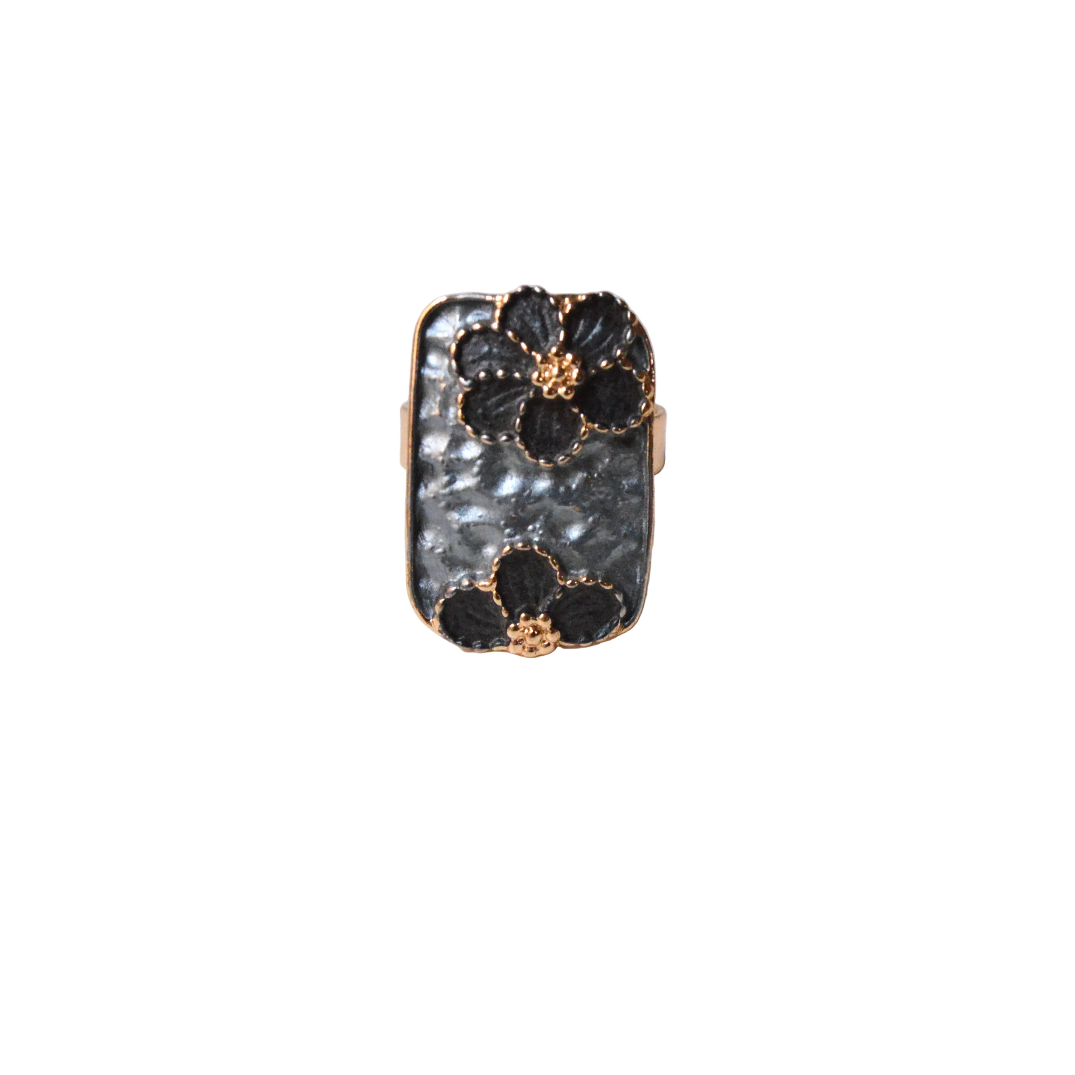 Ring with black floral designs and gray stone on a light gray background