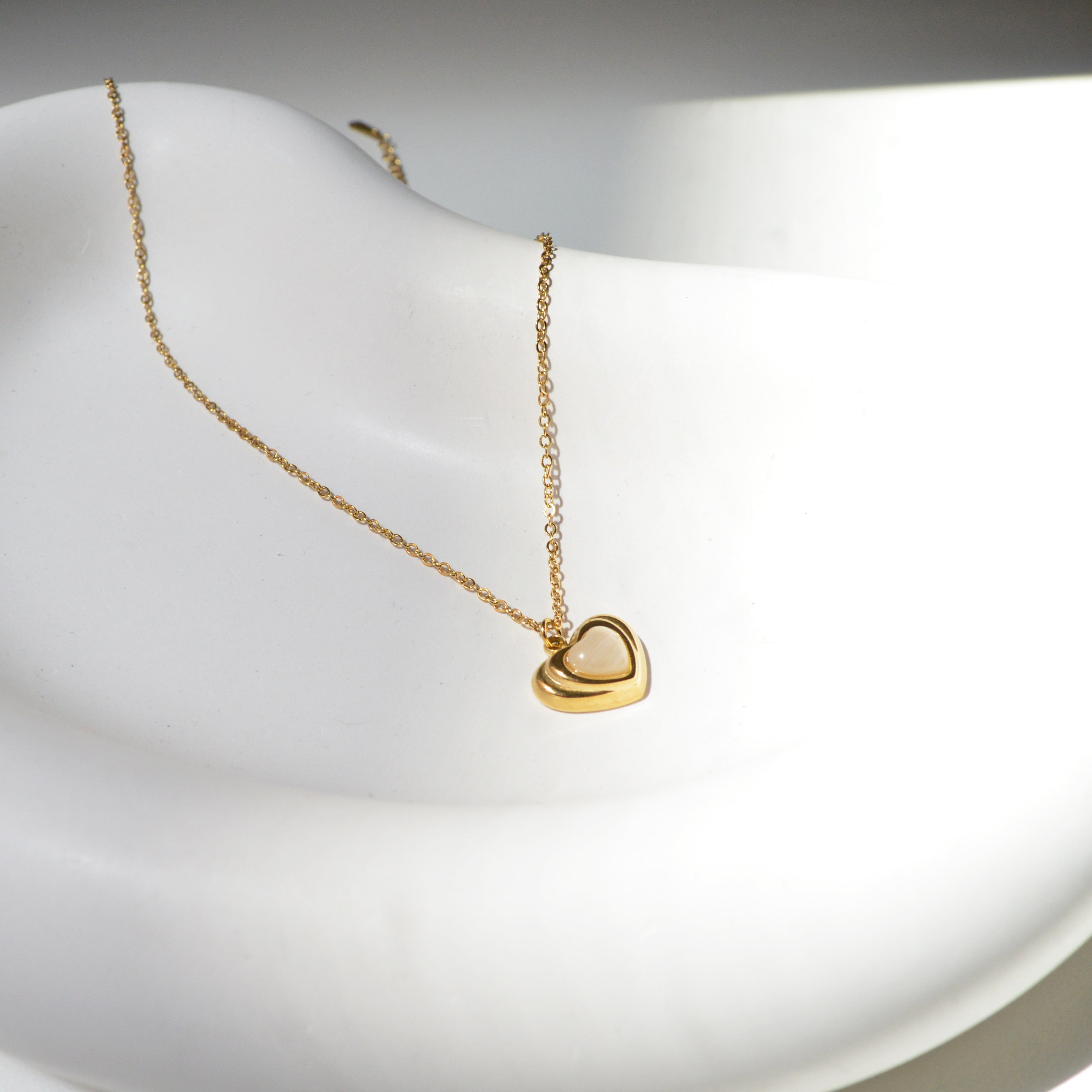 Side view of Dimensional Heart Pendant highlighting the depth and refined metal profiling of the design