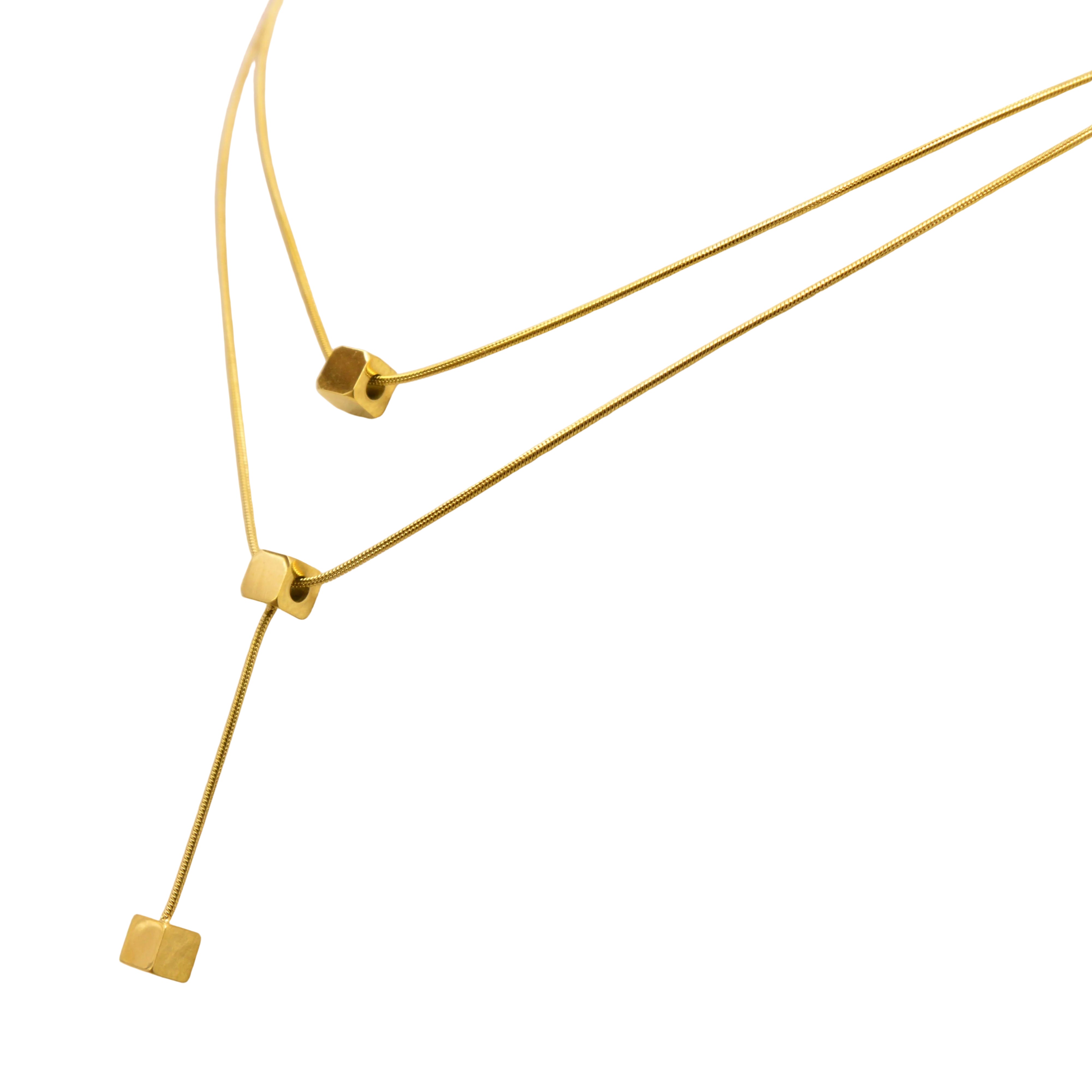 Side angle of Cube Stack Pendant highlighting the sleek dual-chain structure and the geometry of the cube drops