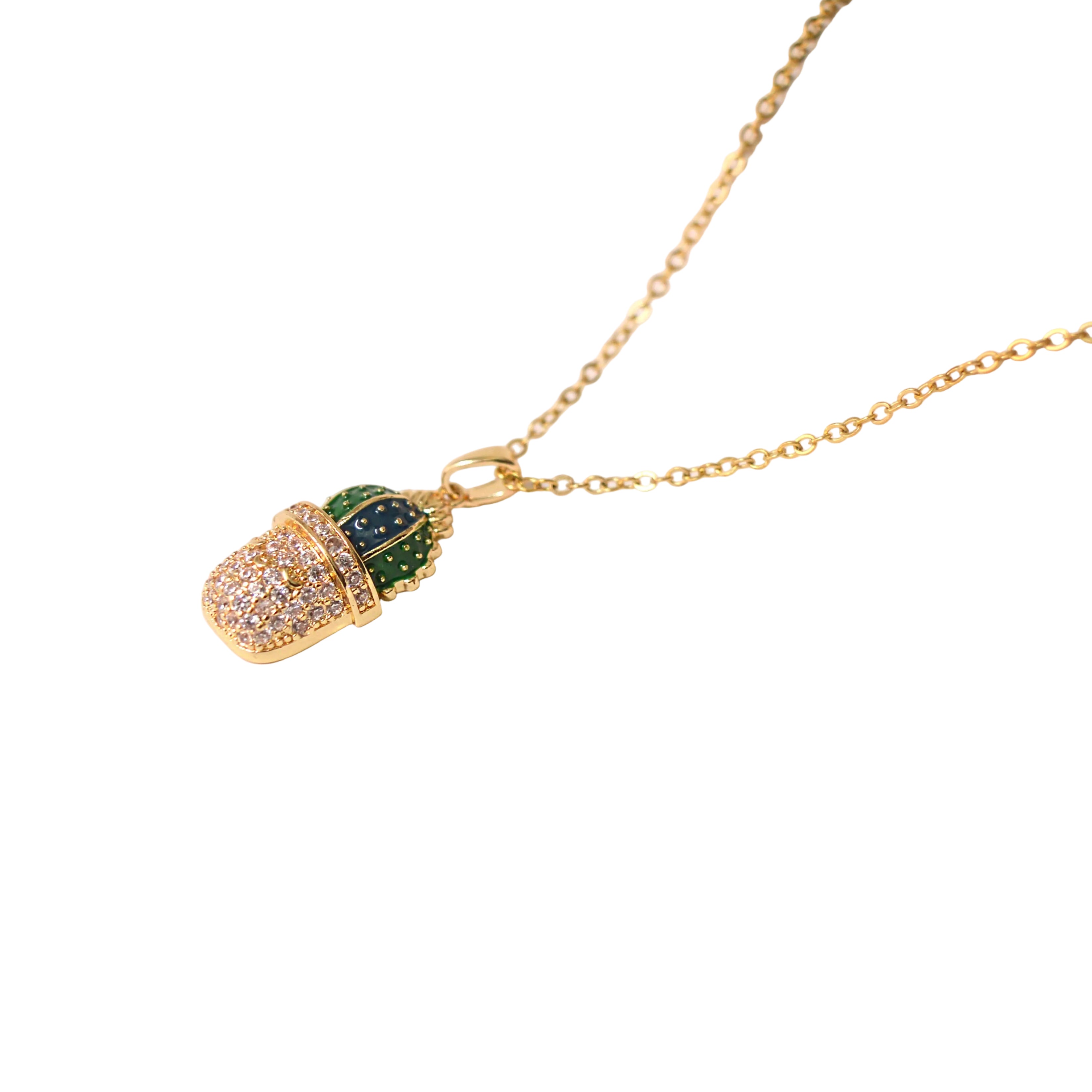 A gold chain necklace with a cactus pendant, displayed on a white curved mannequin bust. The cactus pendant features a gold-toned body paved with small clear stones, with green and dark blue-green enamel accents on the top by Civaro