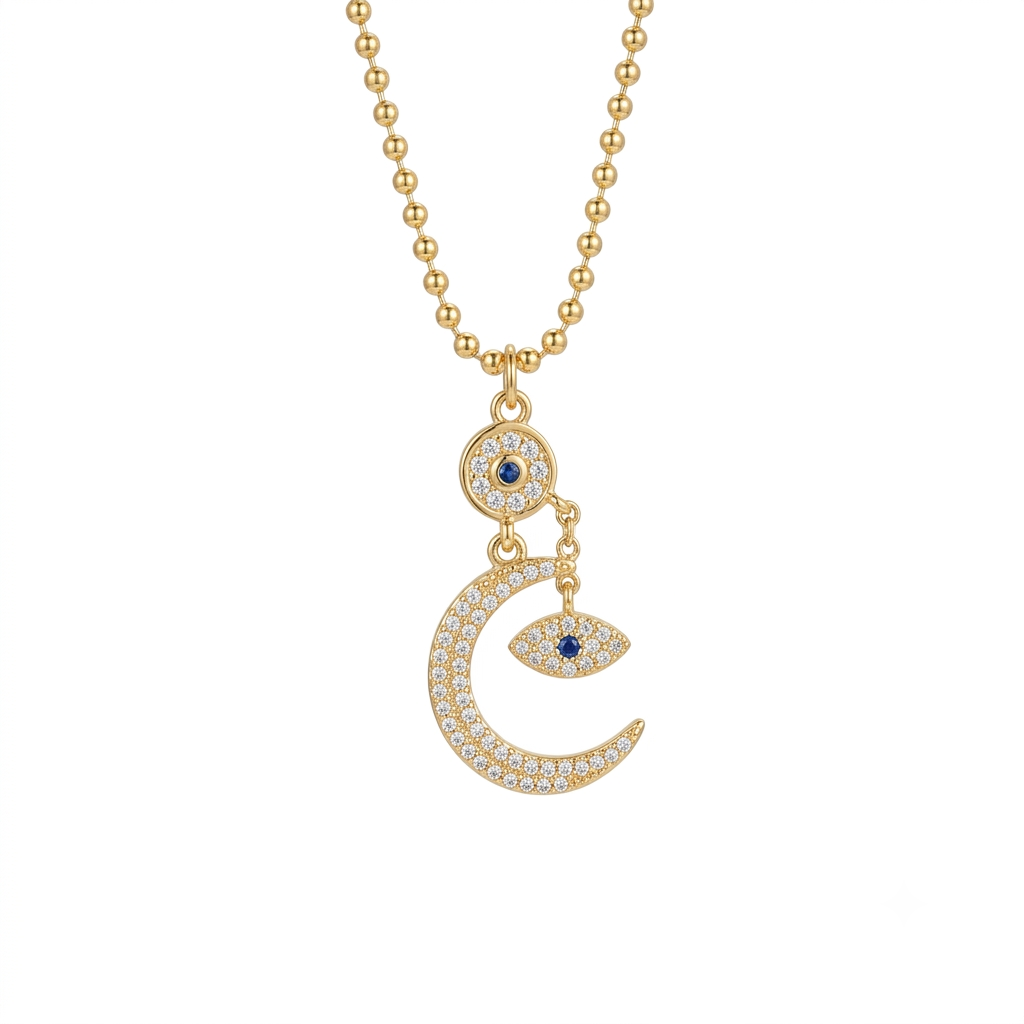 Evil eye moon pendant necklace with cubic zirconia on a gold tone chain.
