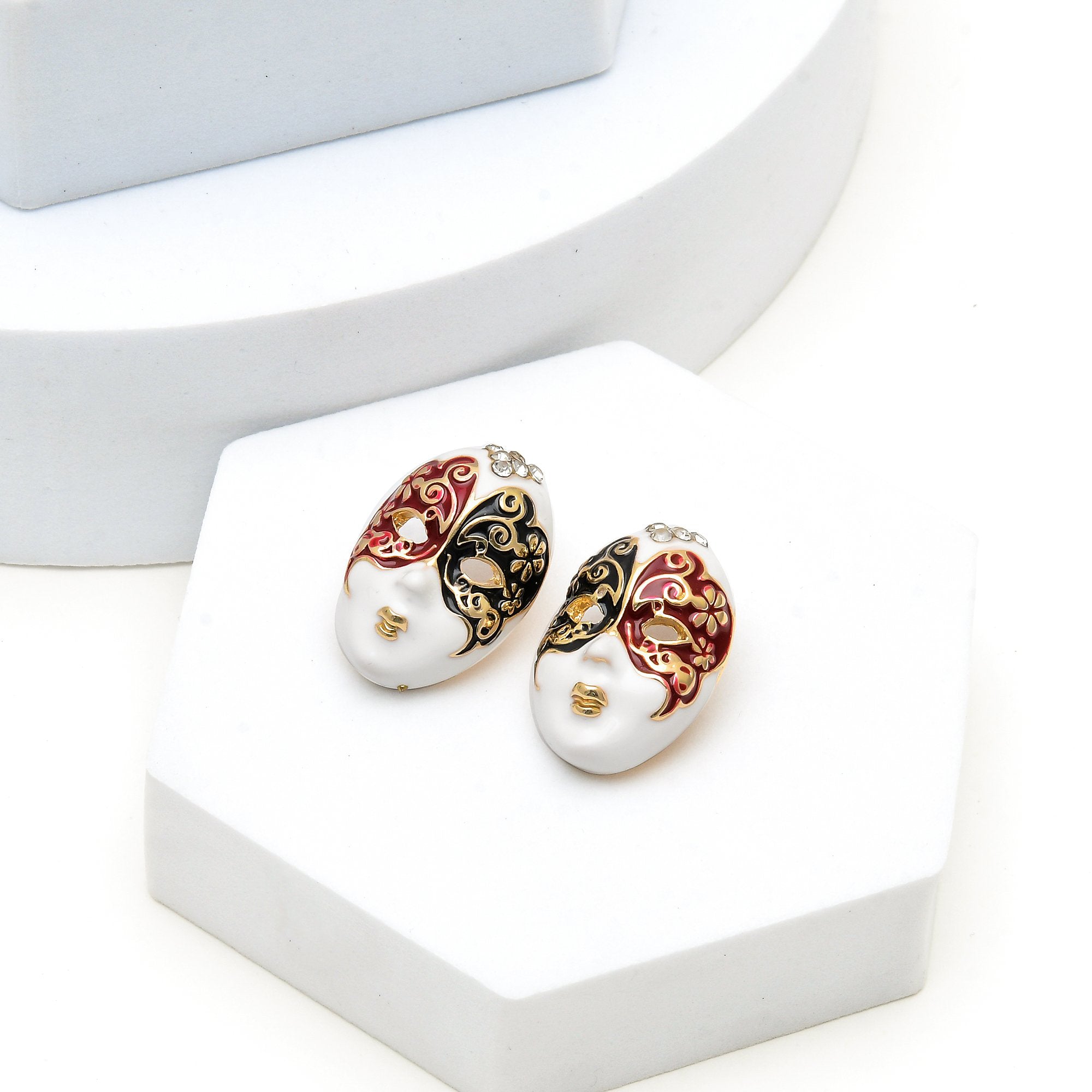 Pair of premium anti tarnish stainless steel masquerade face earrings showing the intricate gold filigree work