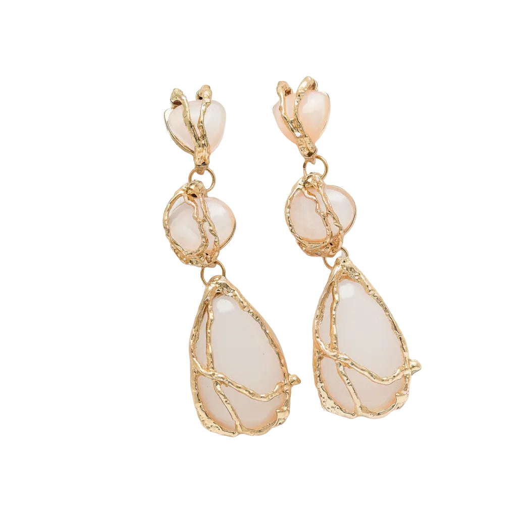 Ivory Vine gold white stone drop earrings in a tiered molten metal setting on white blocks