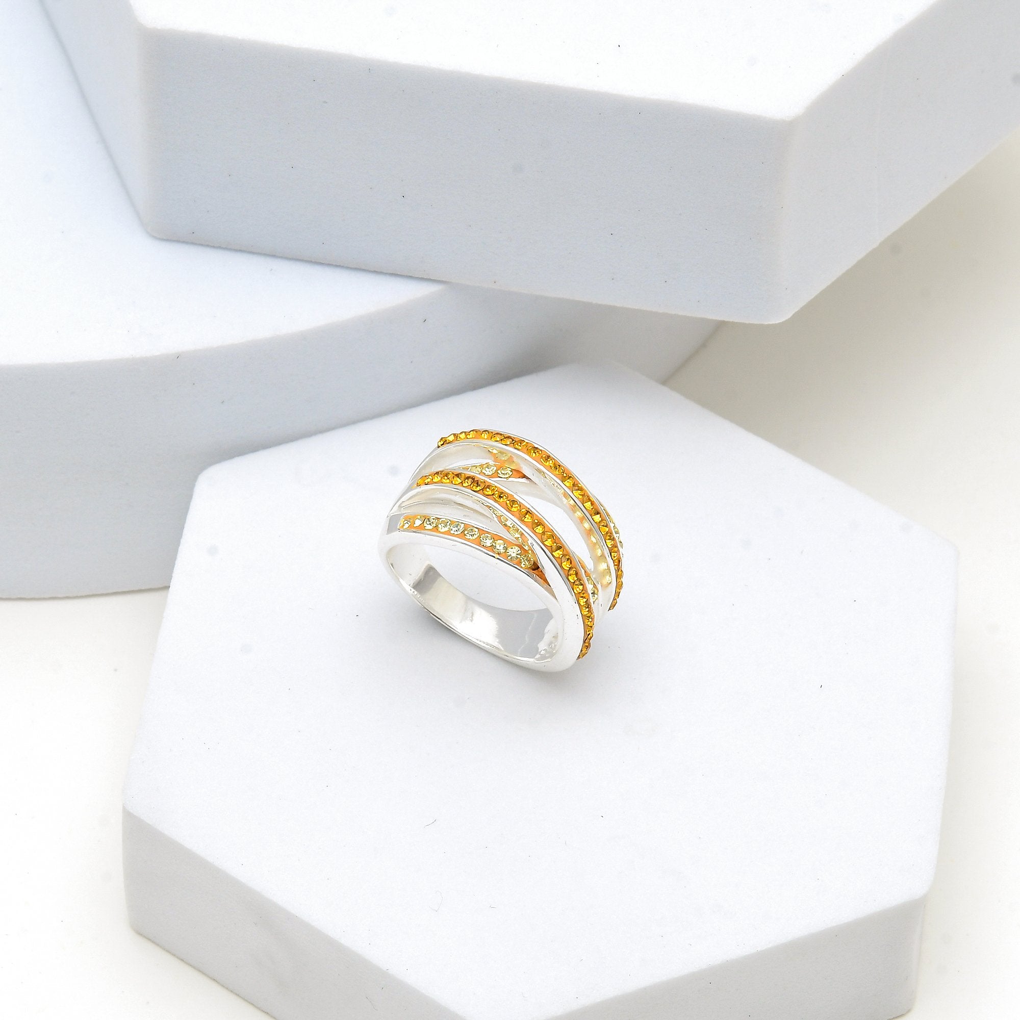 Close-up of the handcrafted crossover architecture and precision hand-set citrine-hued crystals on the Signature Citrine band