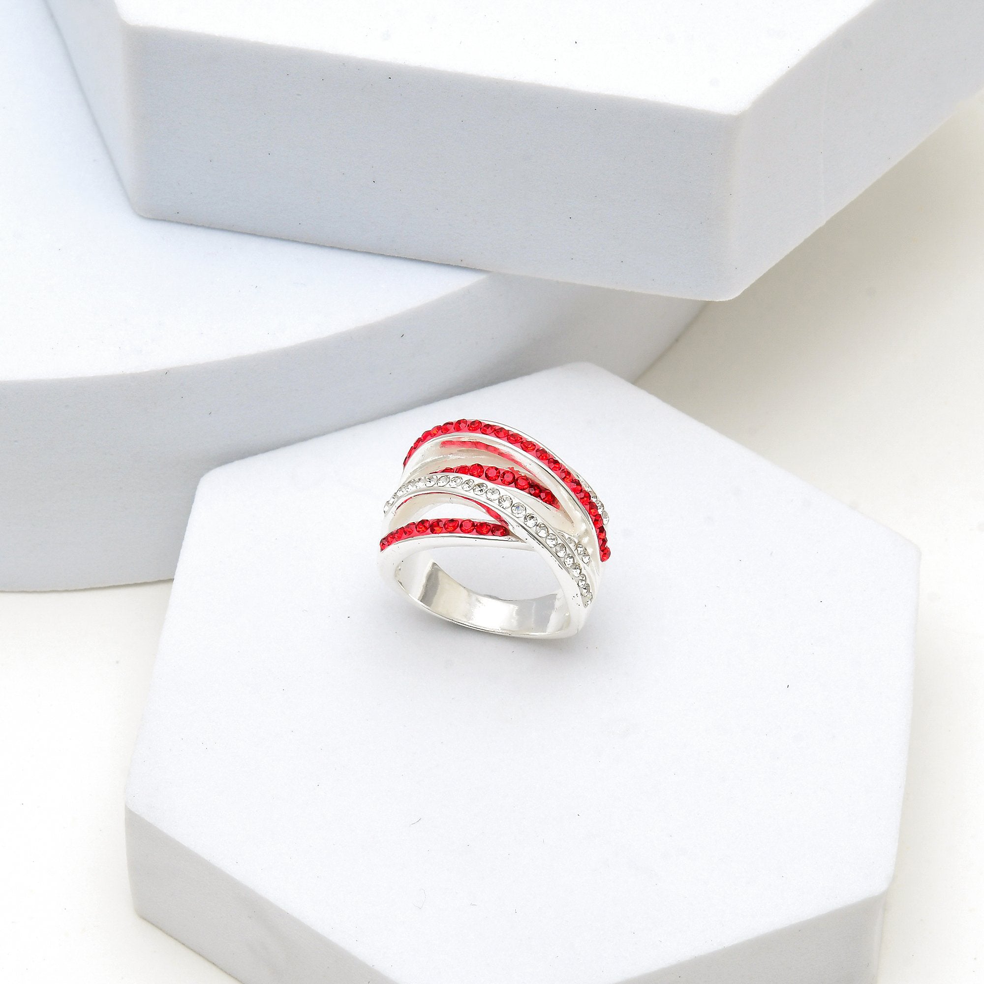  the Signature Crimson Crossover ring to capture the premium weight and reflective luster of the silver-plated finish