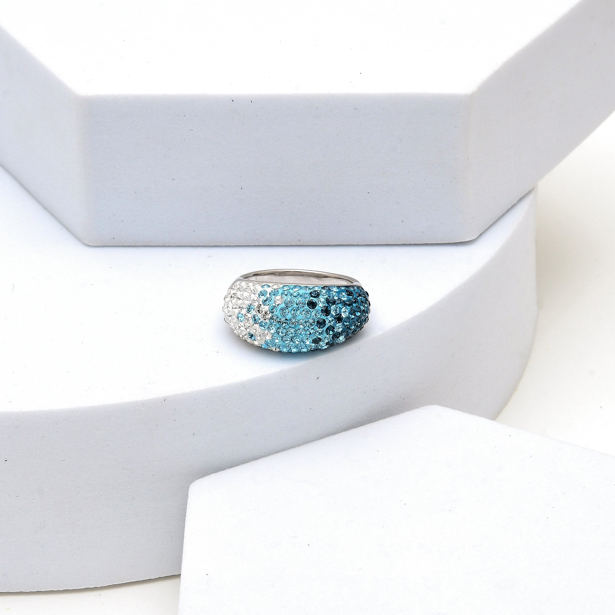 Profile shot of the Signature Ombré Dome ring highlighting the smooth, high-polish silver-tone frame and dome curvature
