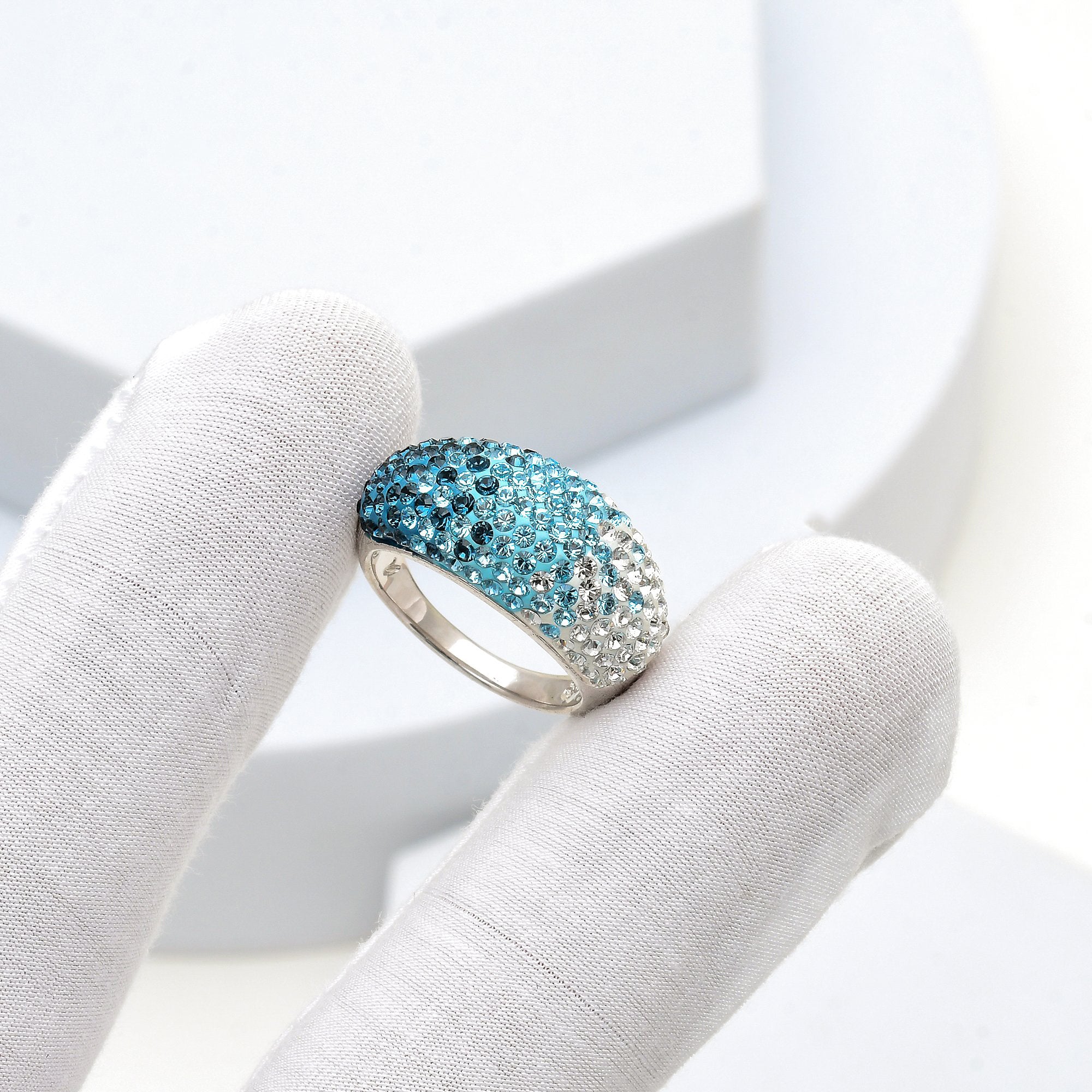 Close-up of the handcrafted dome surface and precision hand-set crystal ombré transition on the Signature Ombré ring