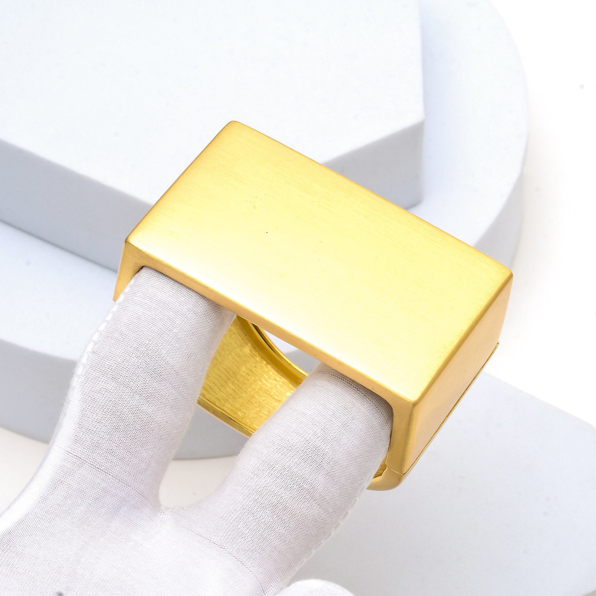 Close-up of the handcrafted brushed texture and integrated hinge mechanism of the Signature Architectural cuff