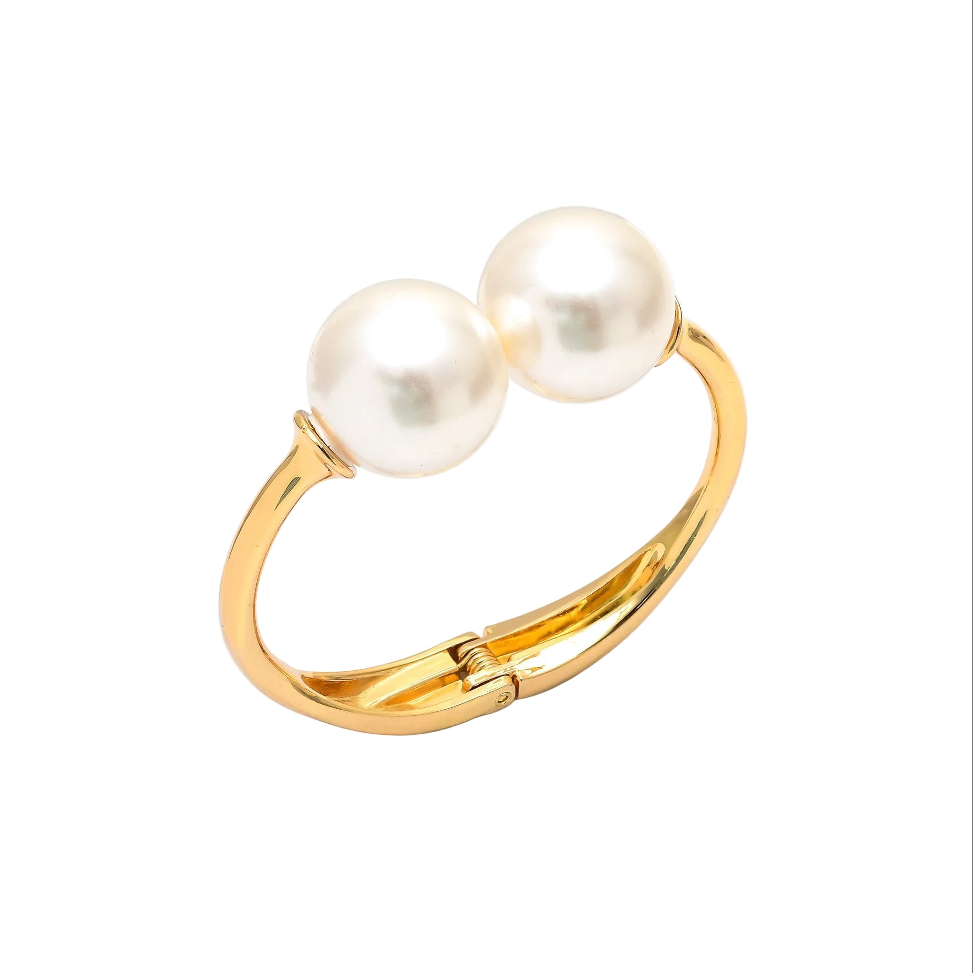 Juno Double Pearl Bangle featuring a polished gold-toned stainless steel band and two oversized lustrous pearls on a white display block