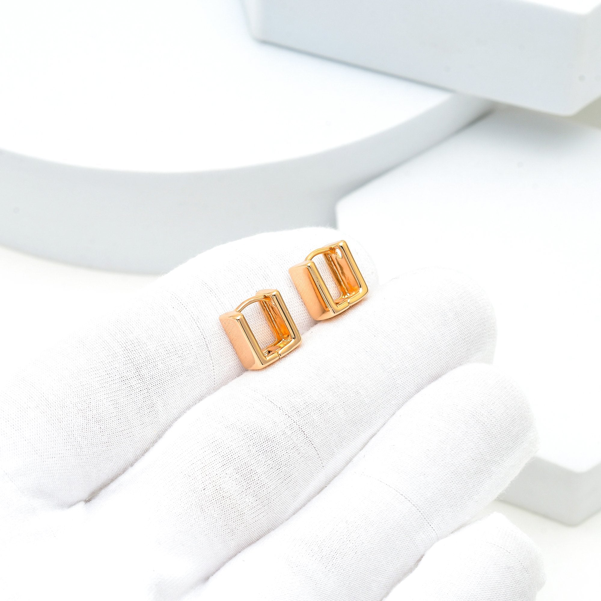 Rose gold geometric huggie earrings crafted from premium quality stainless steel