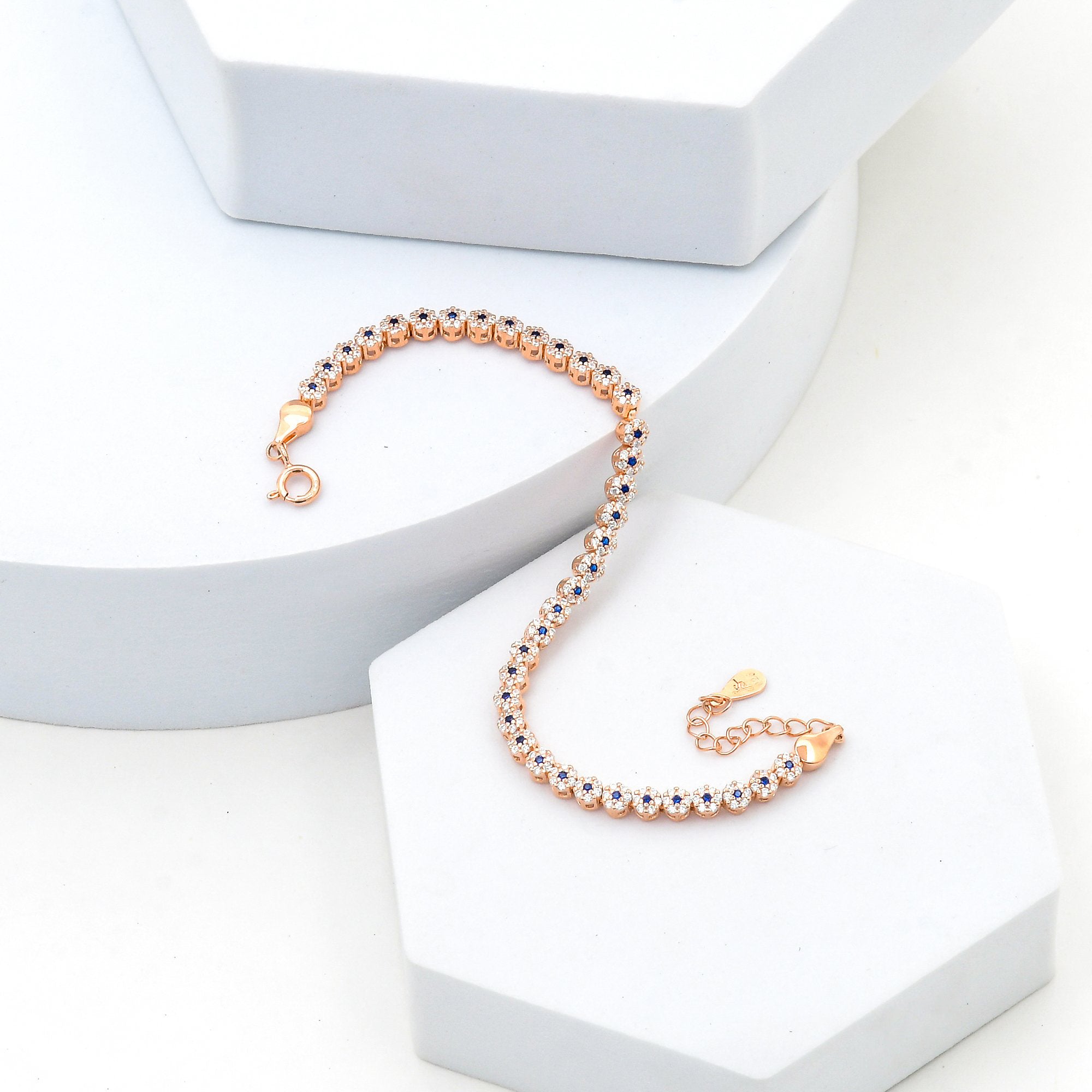 Blue and white stone tennis bracelet in 925 sterling silver with rose gold finish