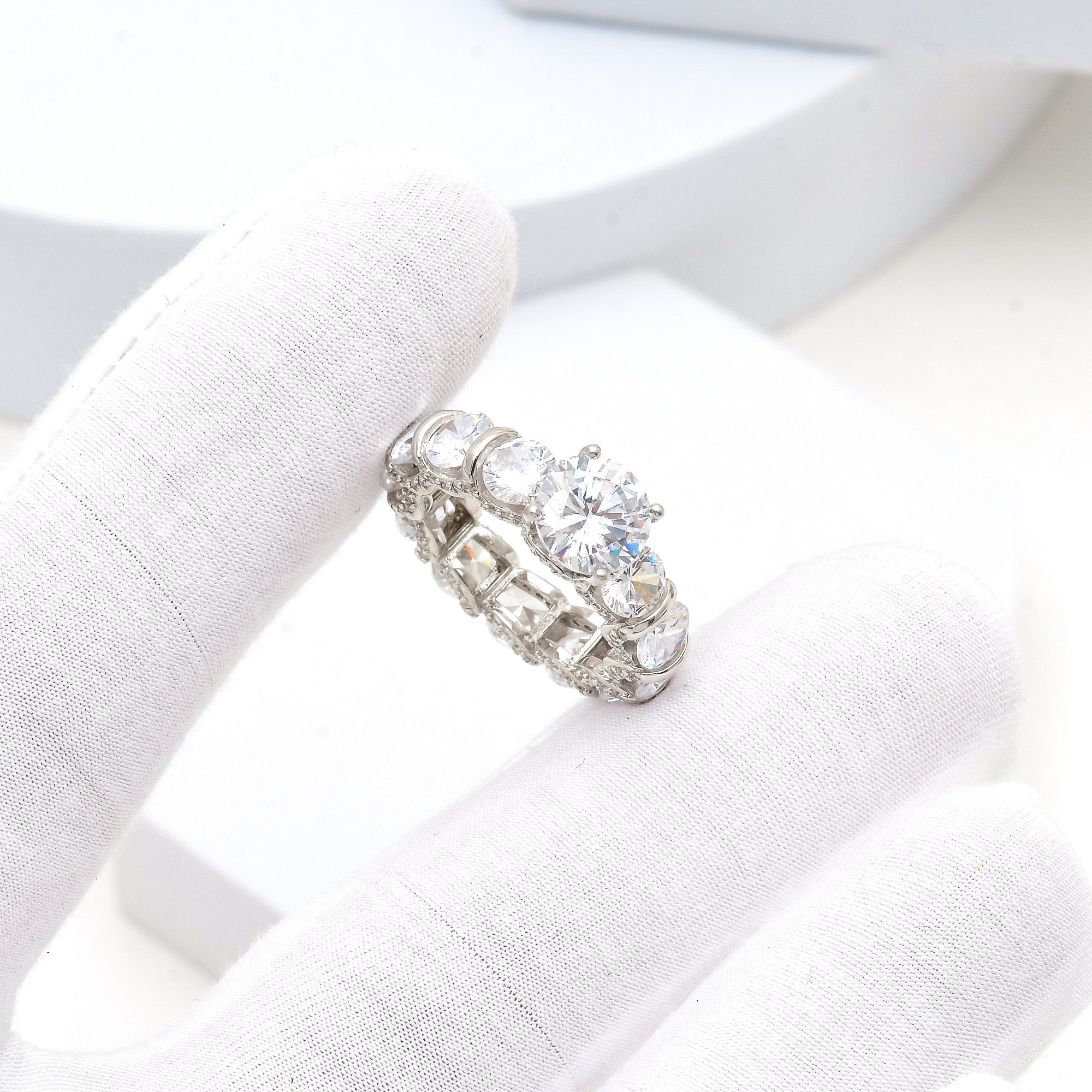 Close-up of 925 silver solitaire CZ ring with sparkling stones