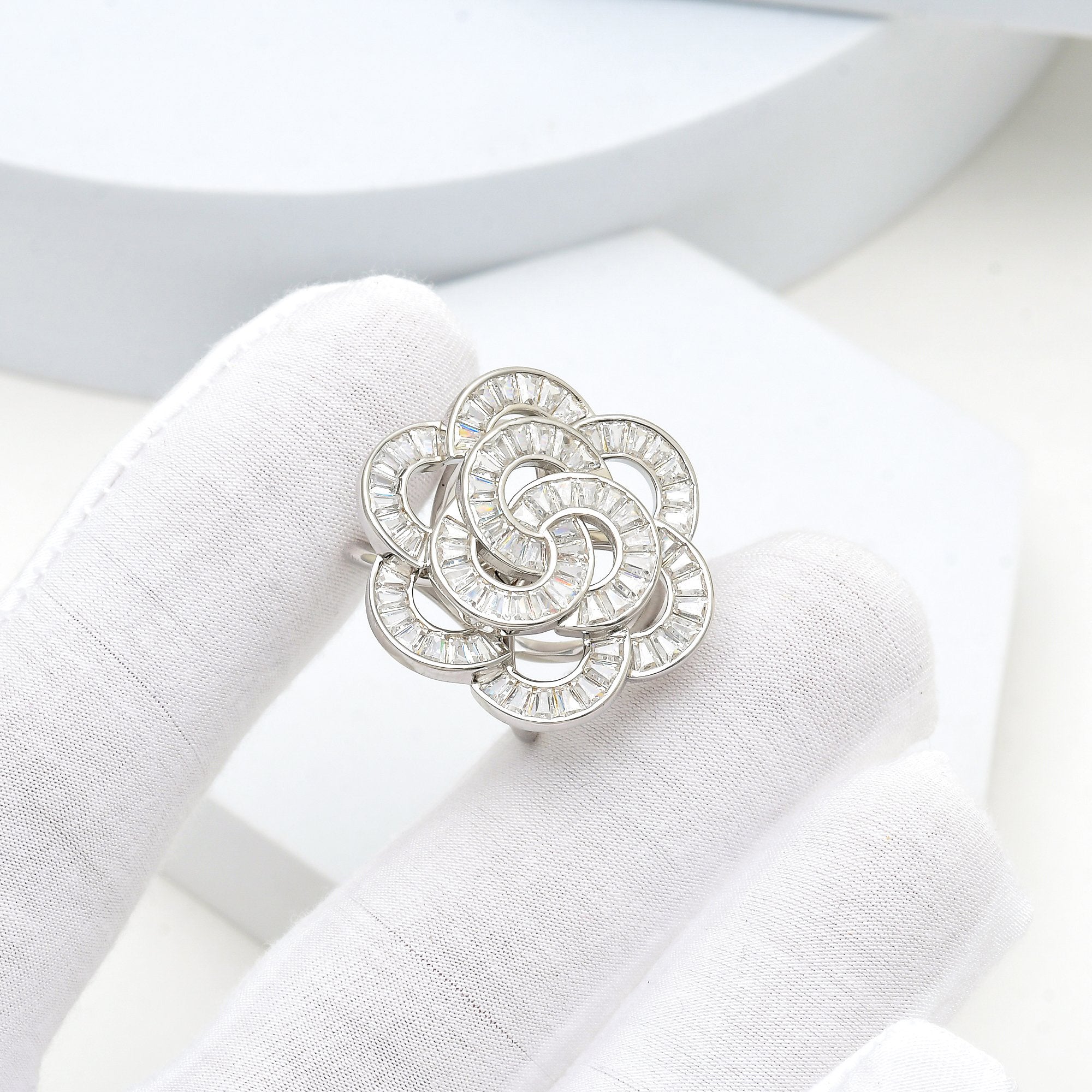 Silver floral ring featuring premium sparkling stones