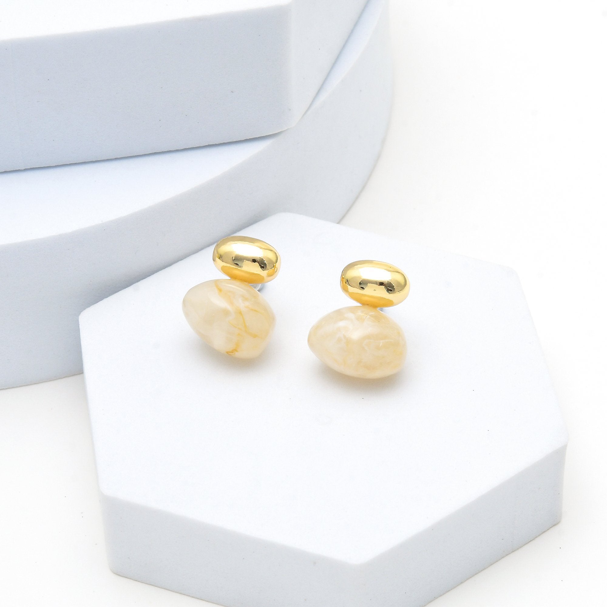 Minimalist statement stud earrings with marbled resin detail by Civaro
