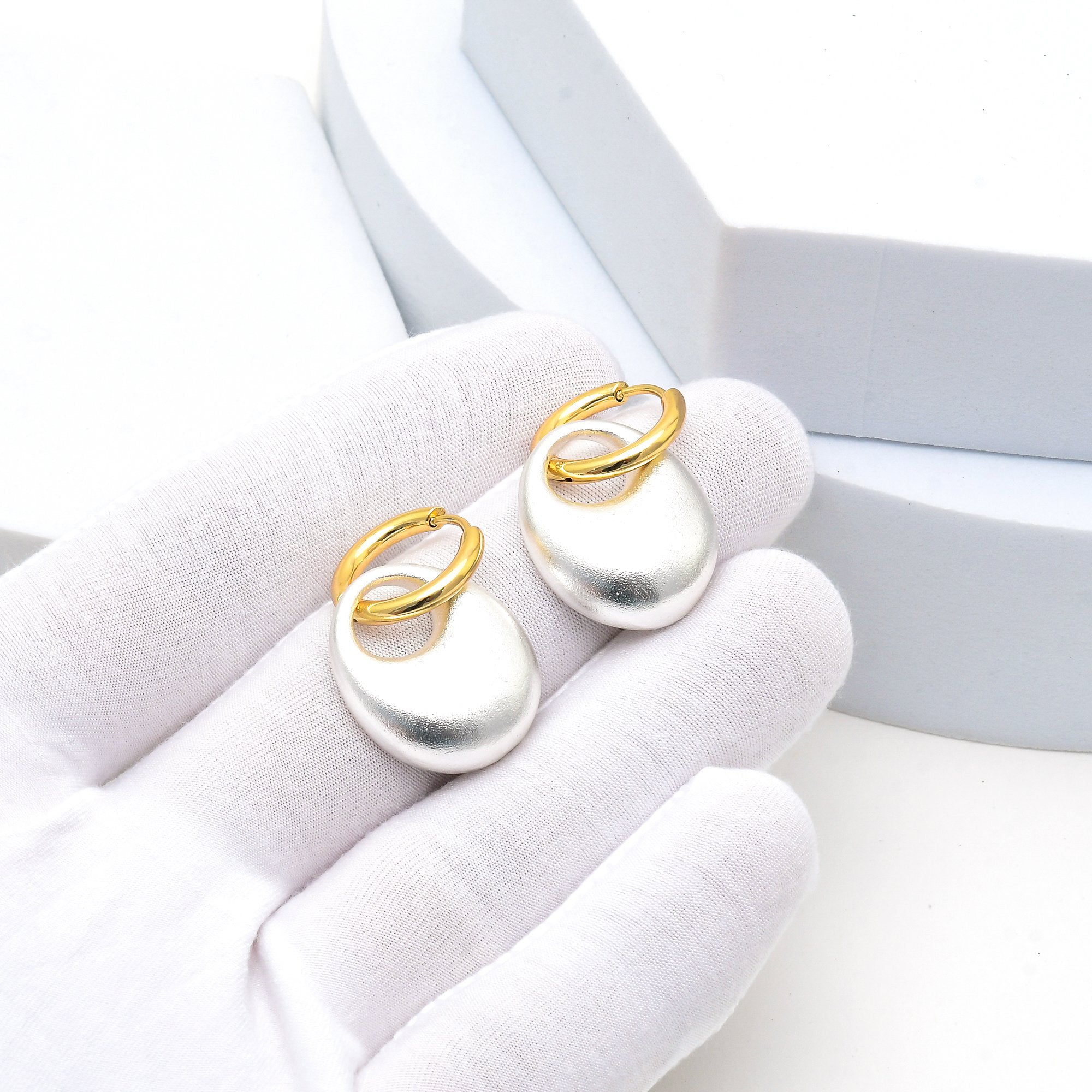 Minimal gold hoop earrings and statement drop earrings in one by Civaro