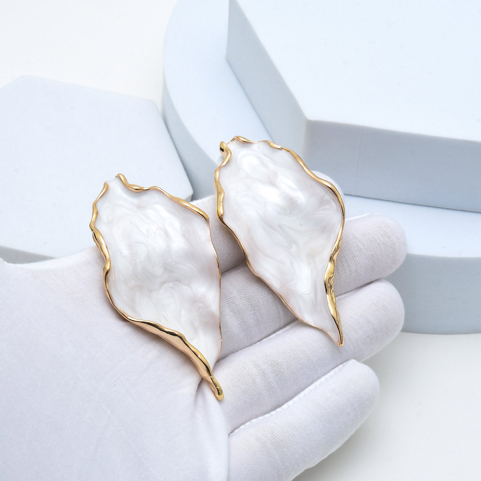     Lightweight oversized acrylic earrings with premium gold edges for elegant everyday styling.