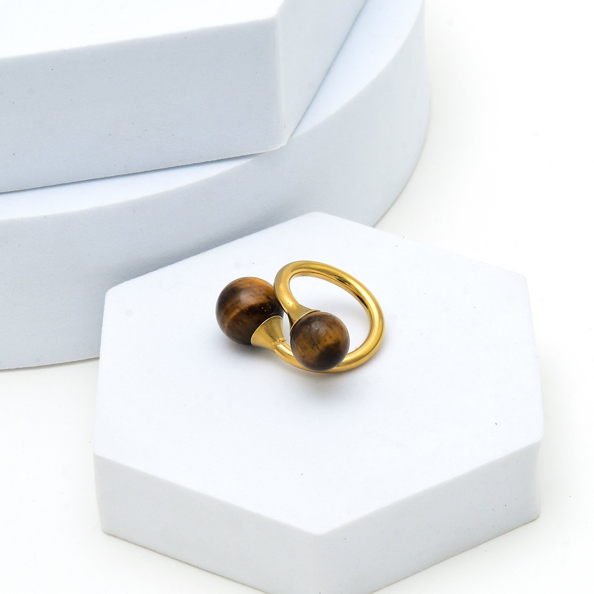    Minimalist gold ring with polished natural tiger eye stones.