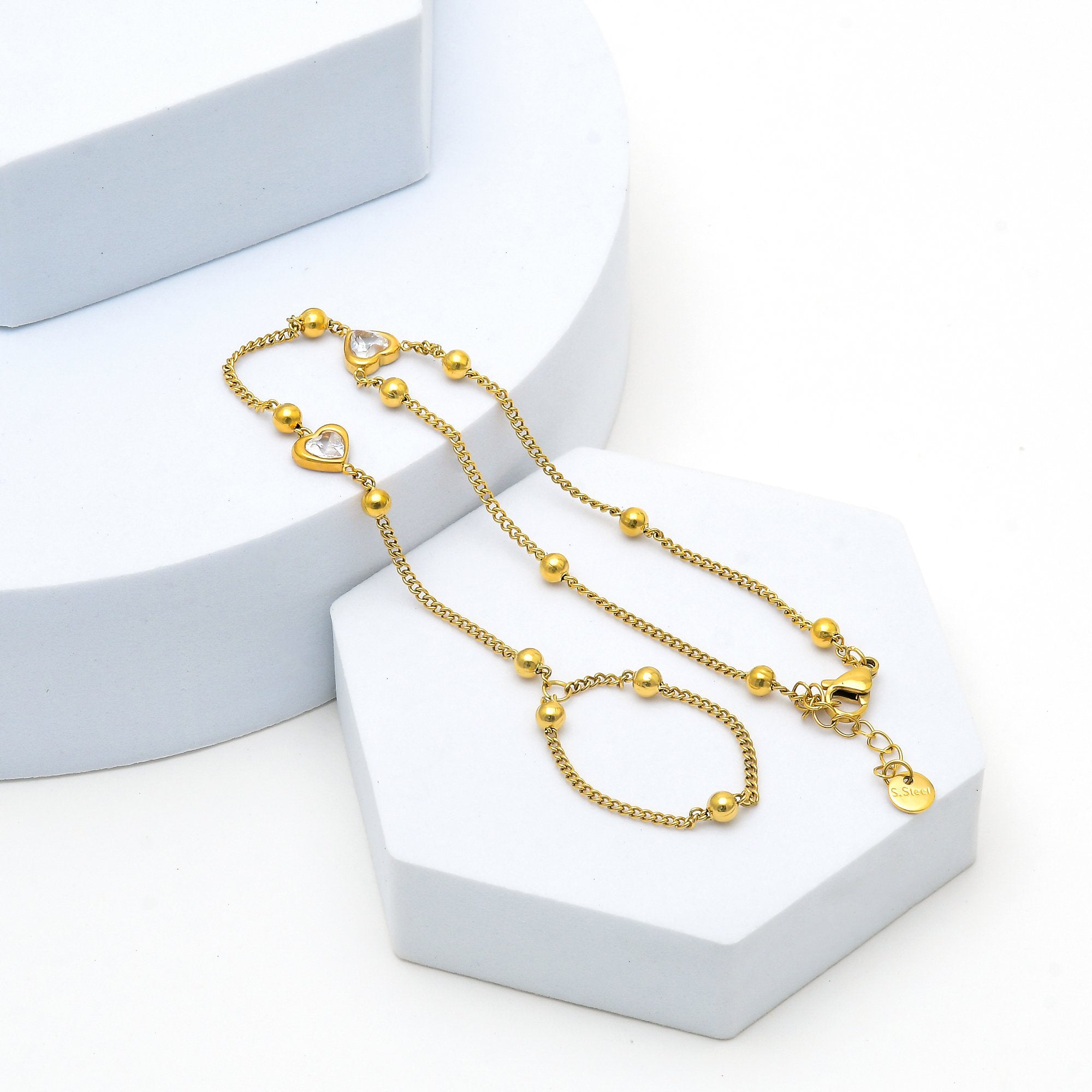 Luxury gold hand chain jewellery with sparkling zircon heart accents by civaro