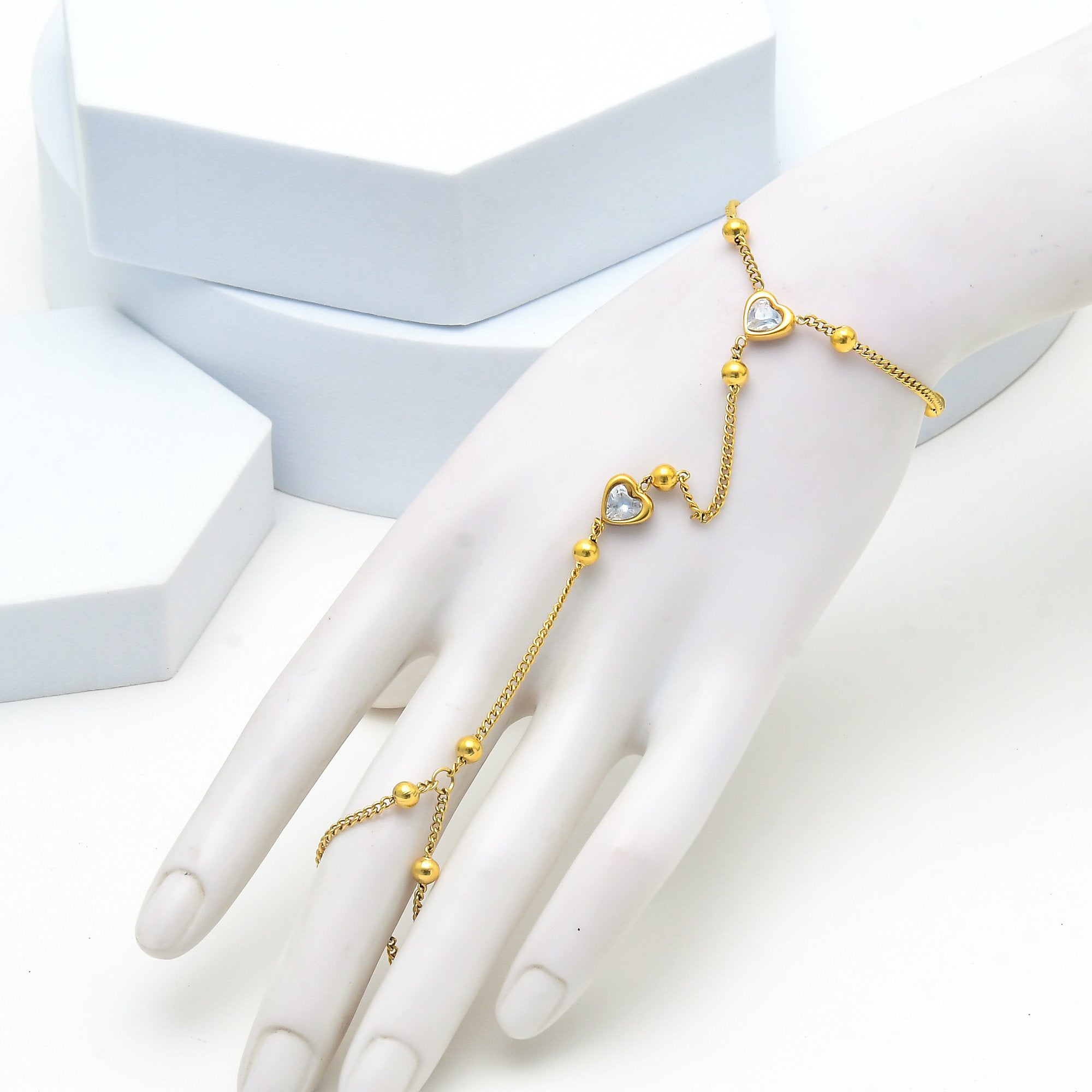 Elegant stainless steel wrist to finger bracelet in gold finish by civaro