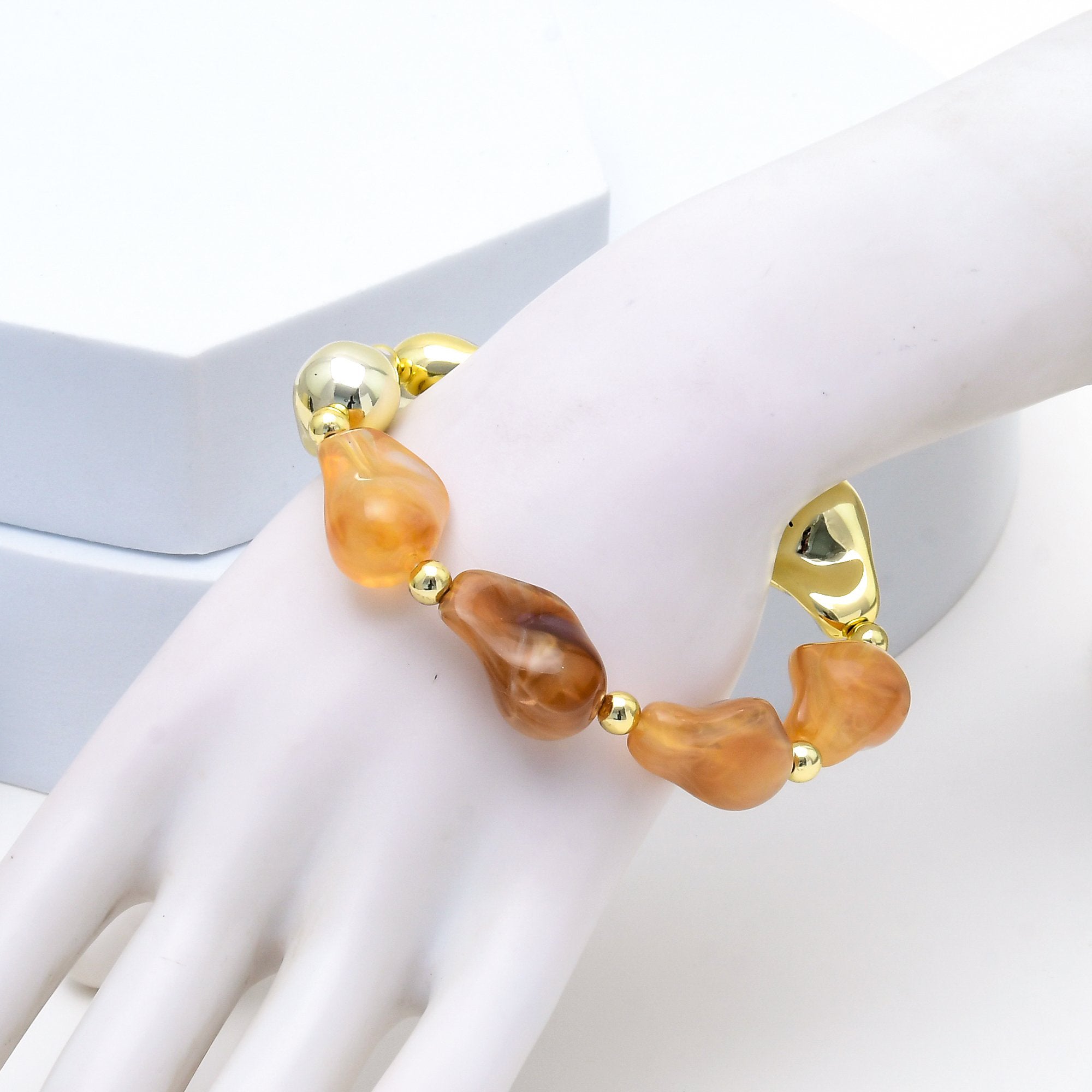 Civaro chunky statement bracelet displayed with oversized acrylic beads in two colour variants