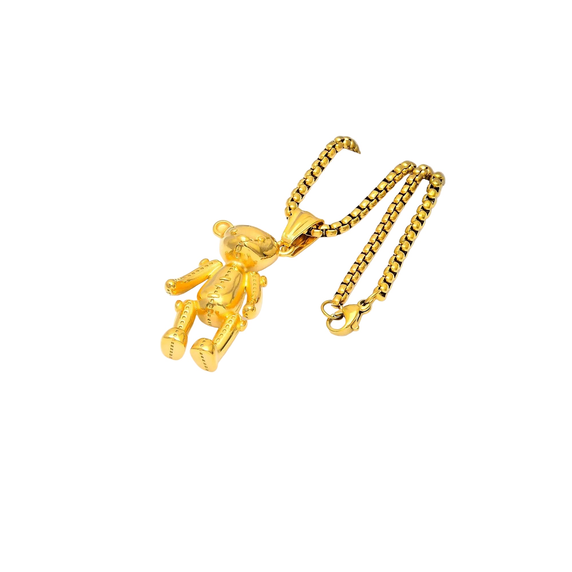 Gold teddy bear pendant on a gold chain against a white background