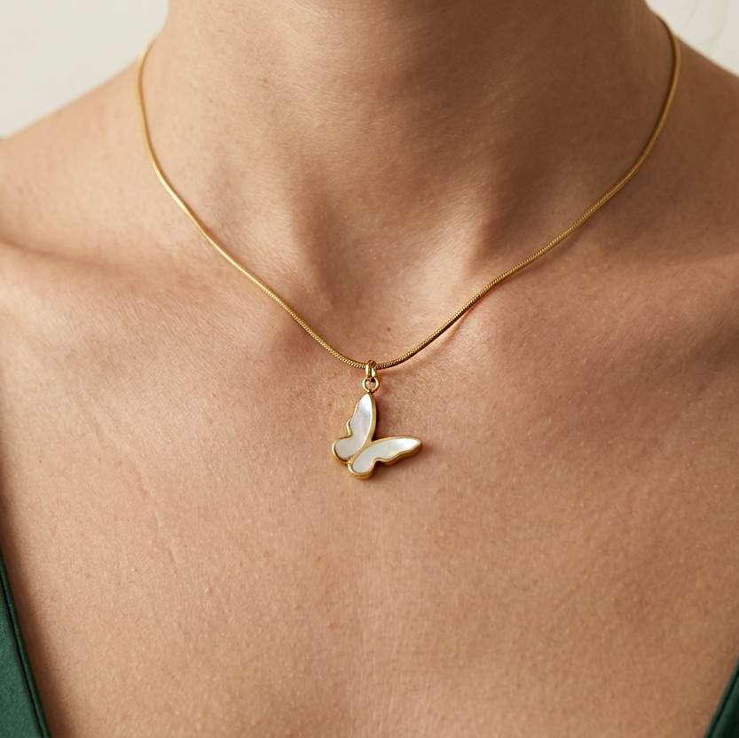 Close-up of hypoallergenic butterfly jewelry with iridescent MOP detailing