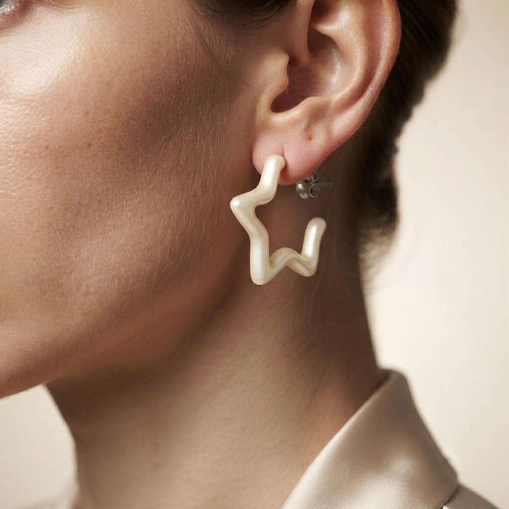 model wearing White pearl star stud earrings with organic sculptural design by Civaro
