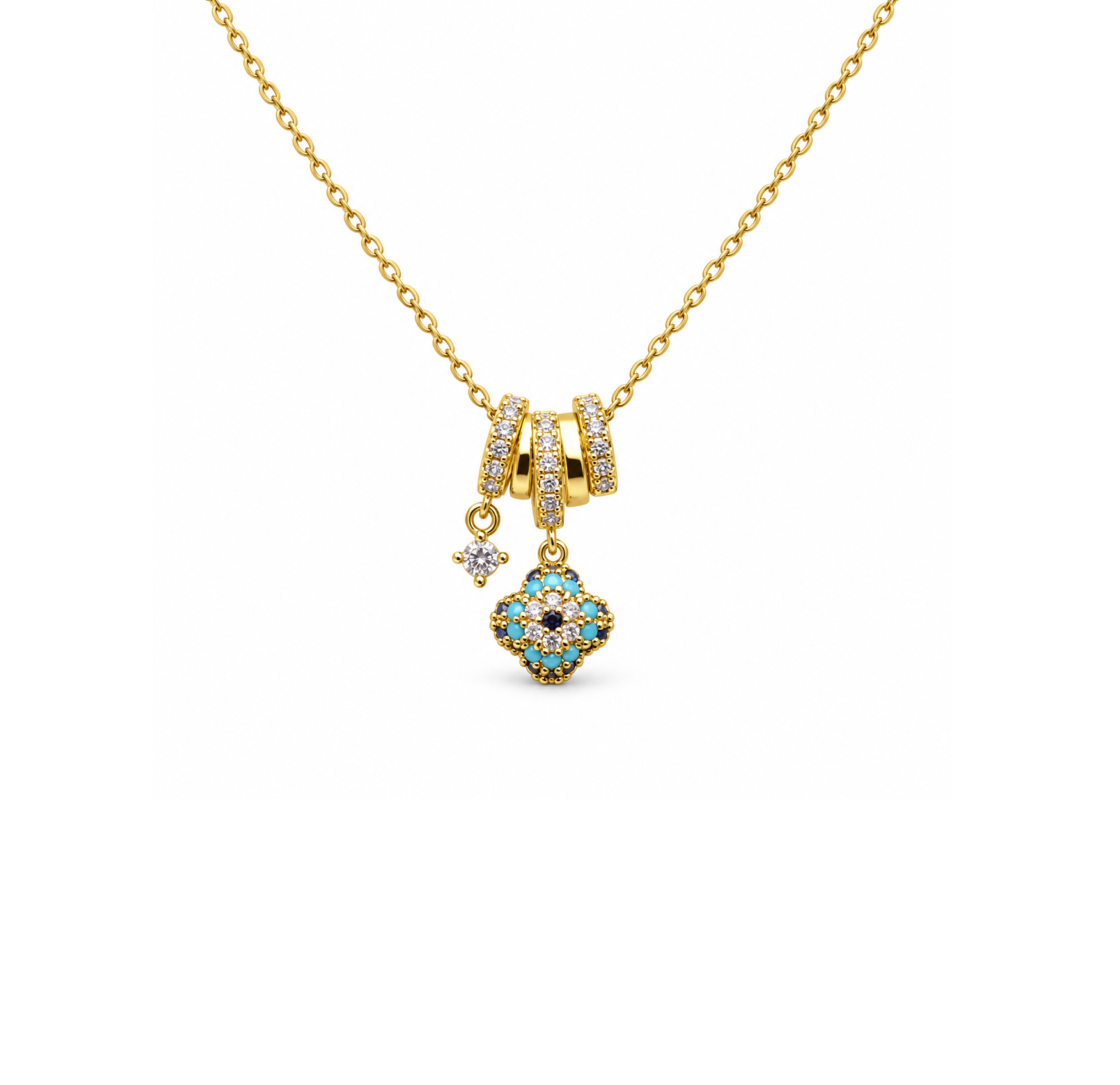 Gold evil eye inspired necklace with blue and clear stone charm detailing by Civaro
A gold chain necklace featuring a multi-component pendant with a central floral clover motif in turquoise and gold, flanked by two small gold rings set with clear stones, and a tiny dangling star charm, shown on a plain white background.
