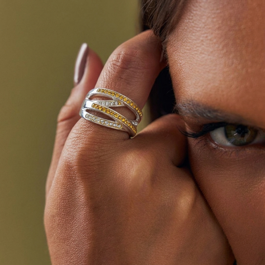 Hand wearing the handcrafted Signature Citrine Crossover ring to demonstrate its substantial weight and warm, golden crystal intensity