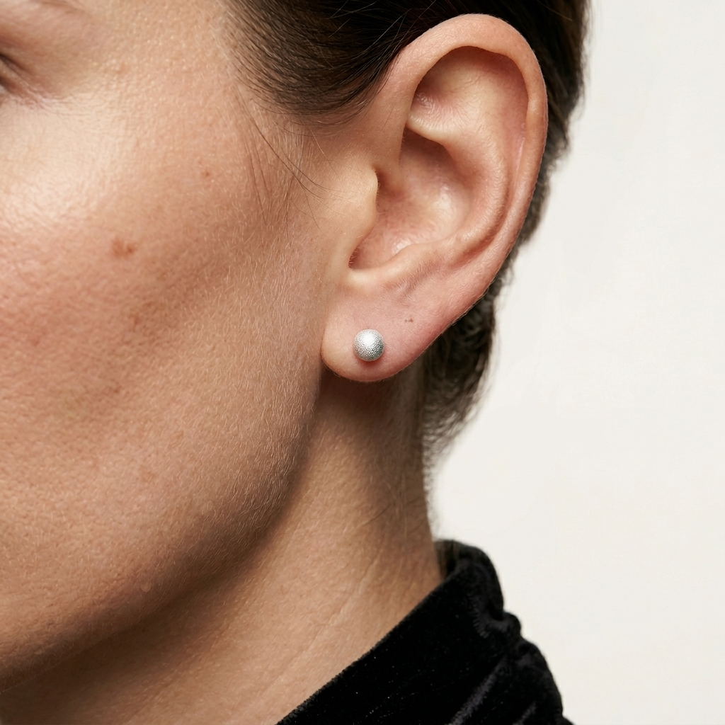Minimal stainless steel stud earrings with sparkling textured surface