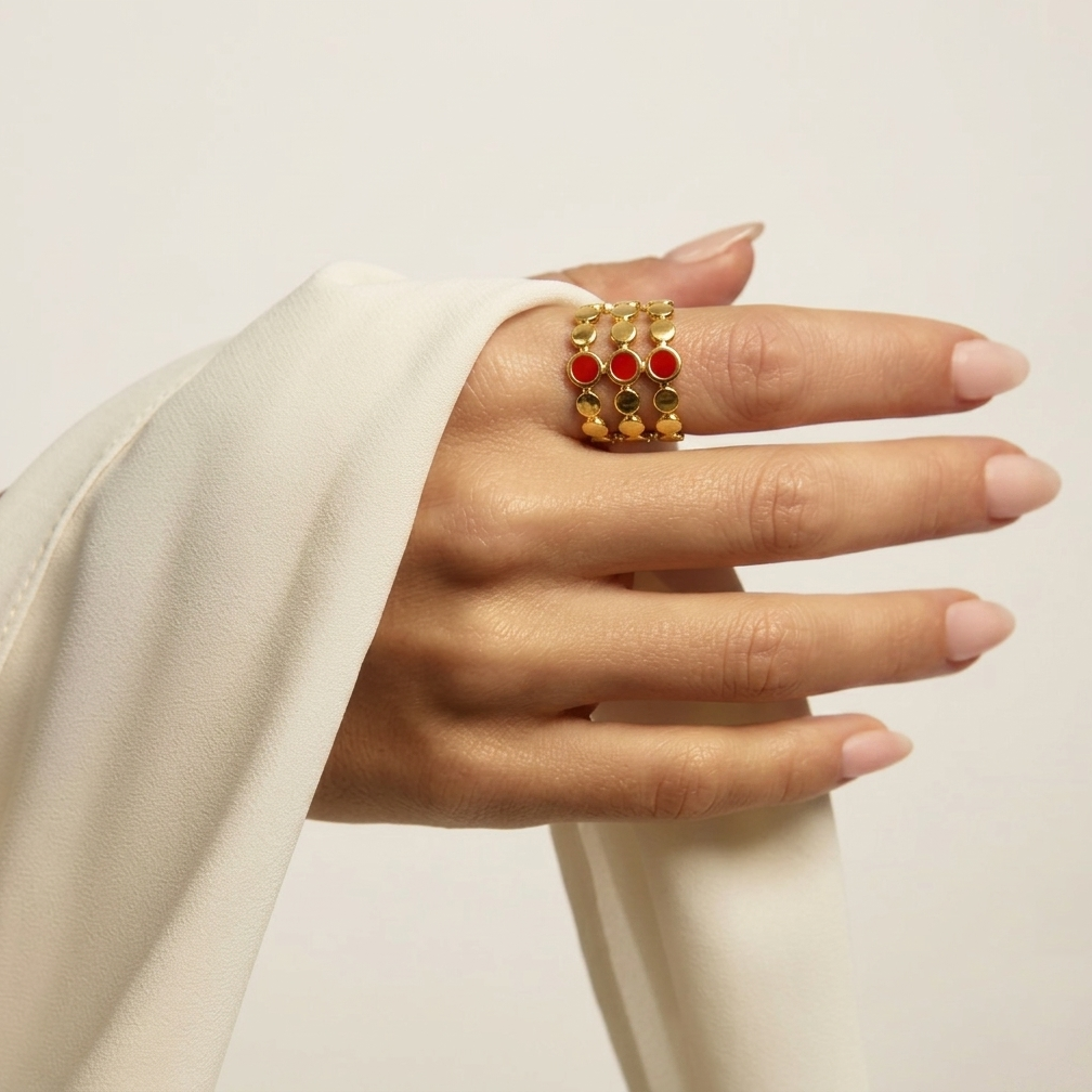 Model styling the wide three-row Crimson Signet cage ring to showcase its bold scale and finger coverage