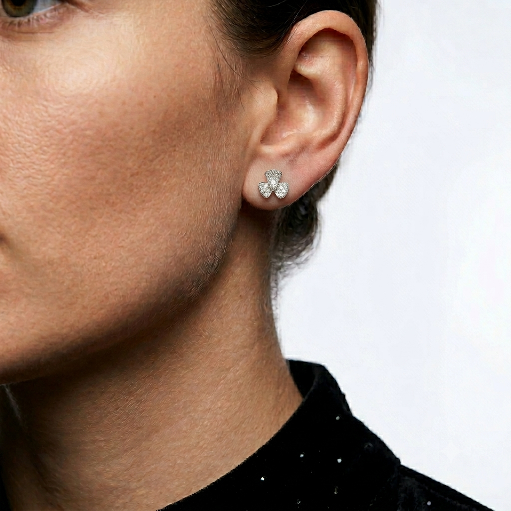 Model wearing 925 sterling silver bow stud earrings