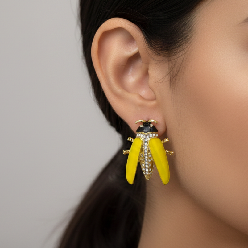 Model wearing The Specimen studs to showcase their substantial, playful scale and vibrant color against the ear