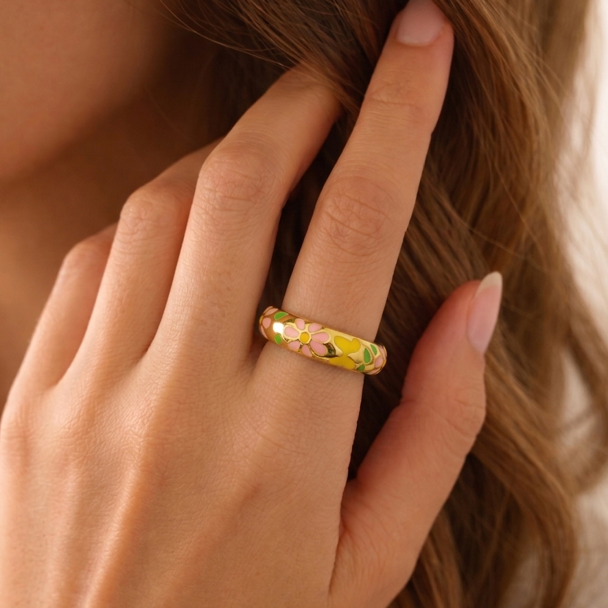 Model wearing daisy bloom enamel ring