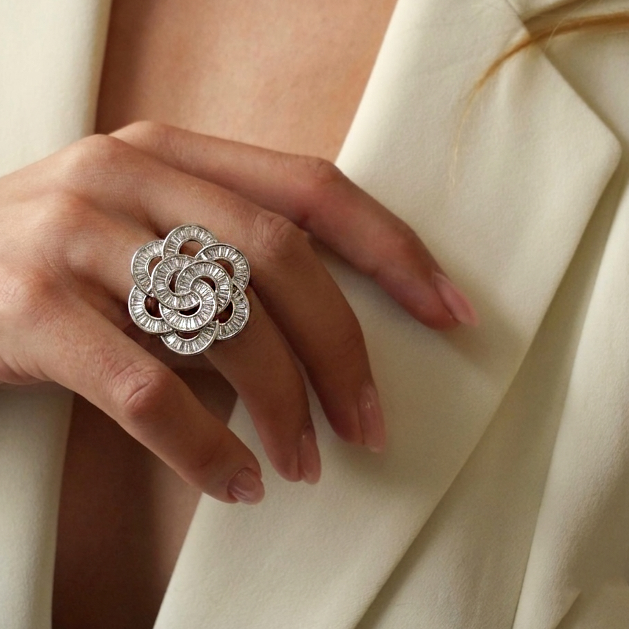 Model wearing floral statement ring in 925 sterling silver