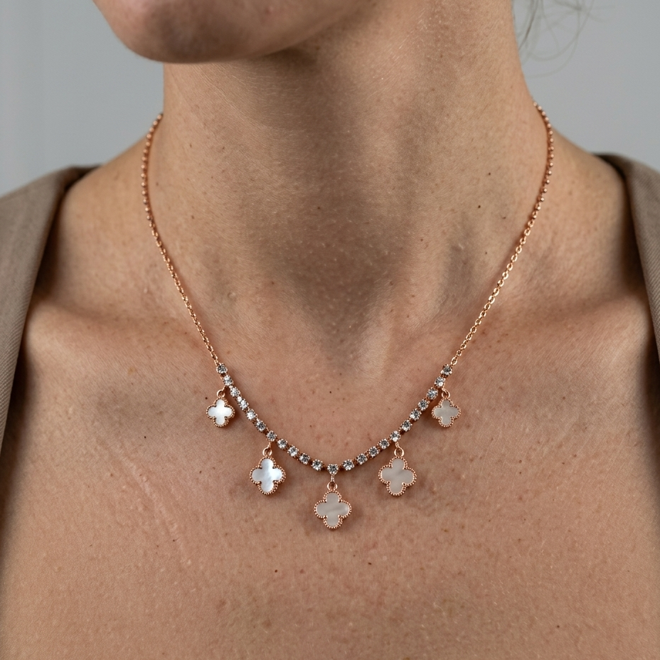 Model wearing rose gold clover necklace with crystal detailing