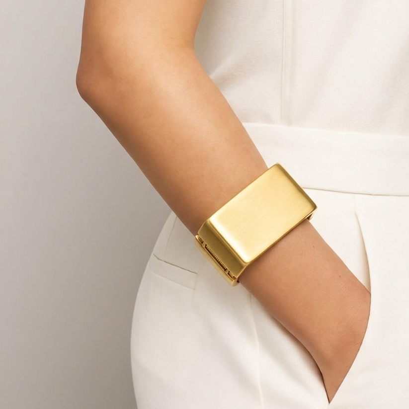 Model wearing the handcrafted Signature Architectural cuff to demonstrate its bold, structural presence on the wrist