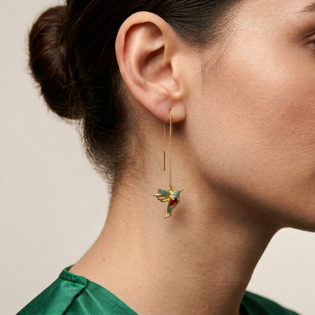     Lightweight gold threader earrings inspired by hummingbirds and nature.