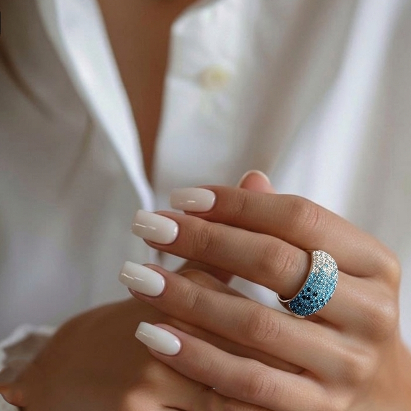 Hand wearing the handcrafted Signature Ombré Dome ring to showcase its substantial weight and light-catching color depth