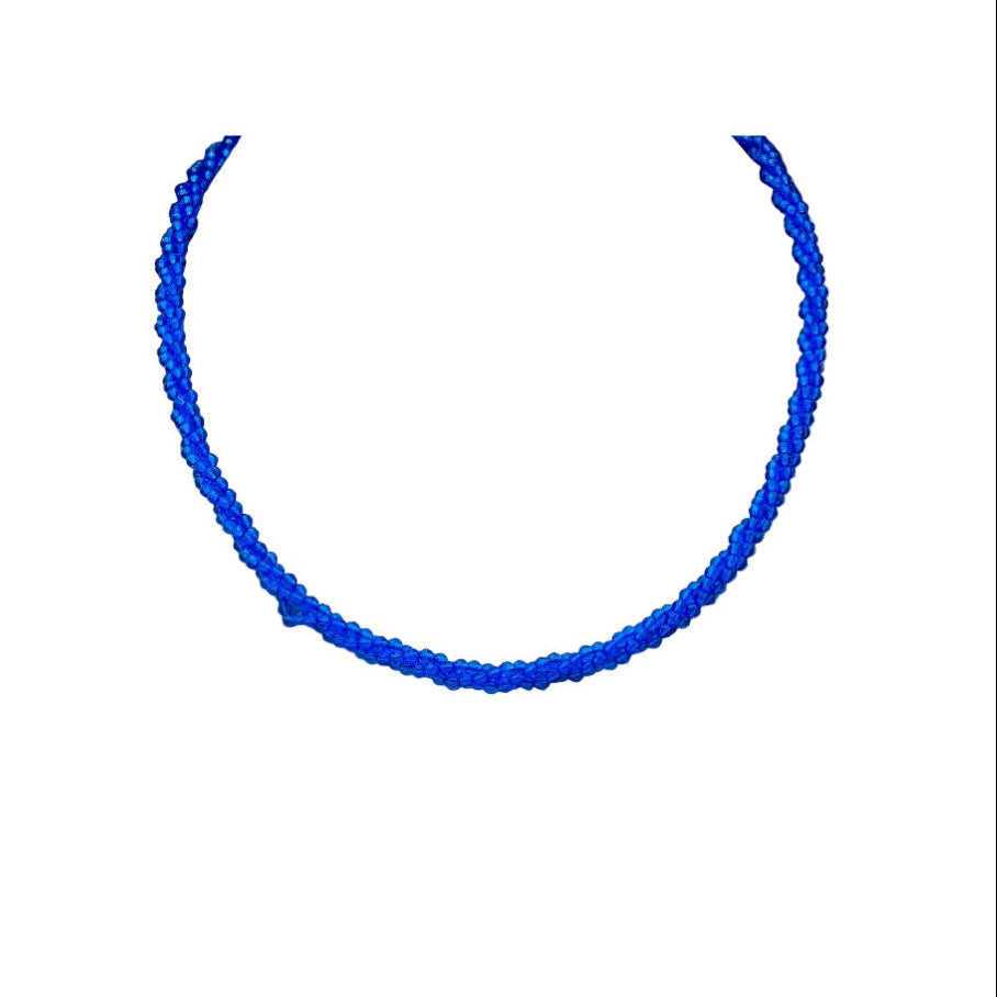 A vibrant blue beaded necklace arranged in a neat semicircle on a plain white background by civaro