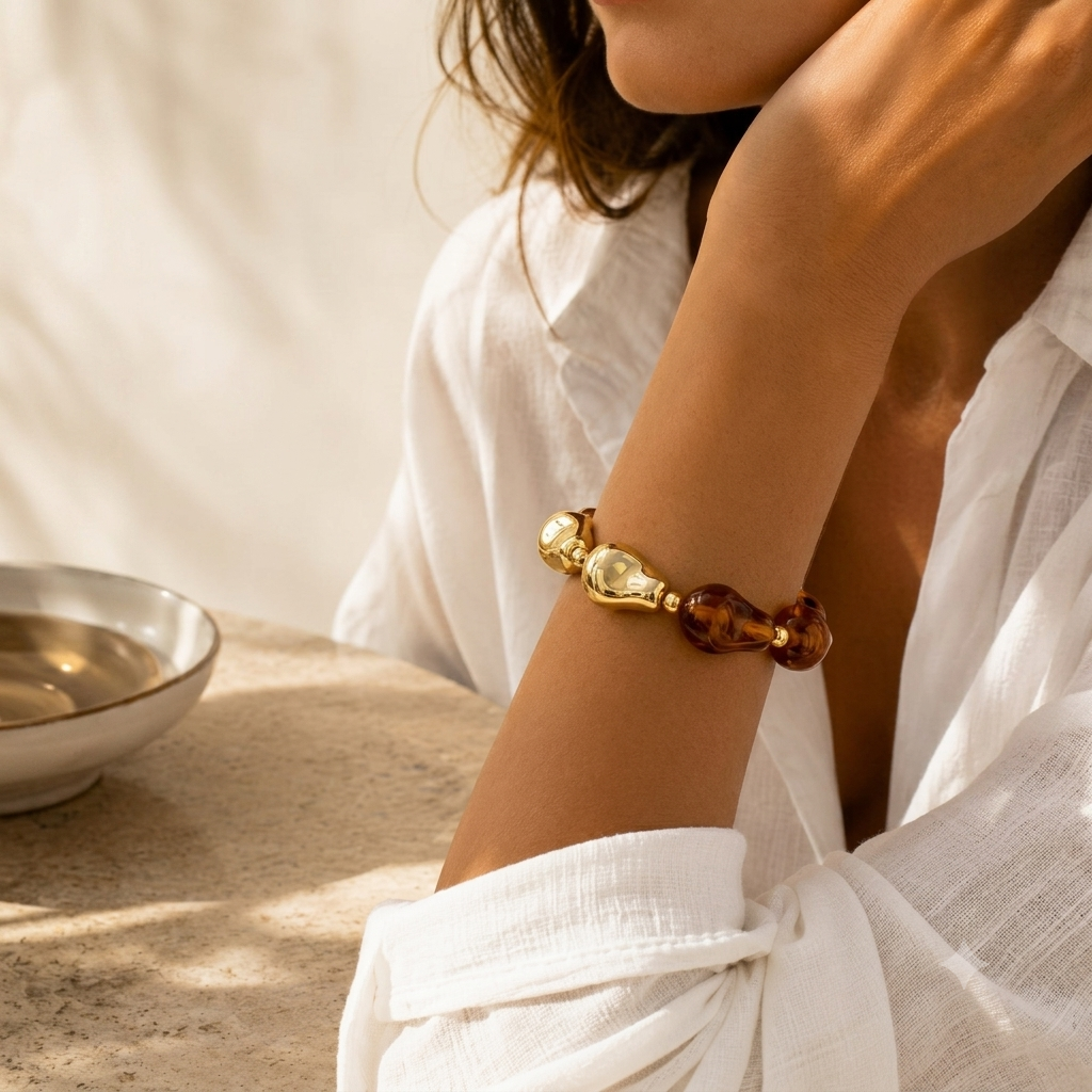 Women wearing bold acrylic bead statement bracelet styled with modern fashion outfit by civaro