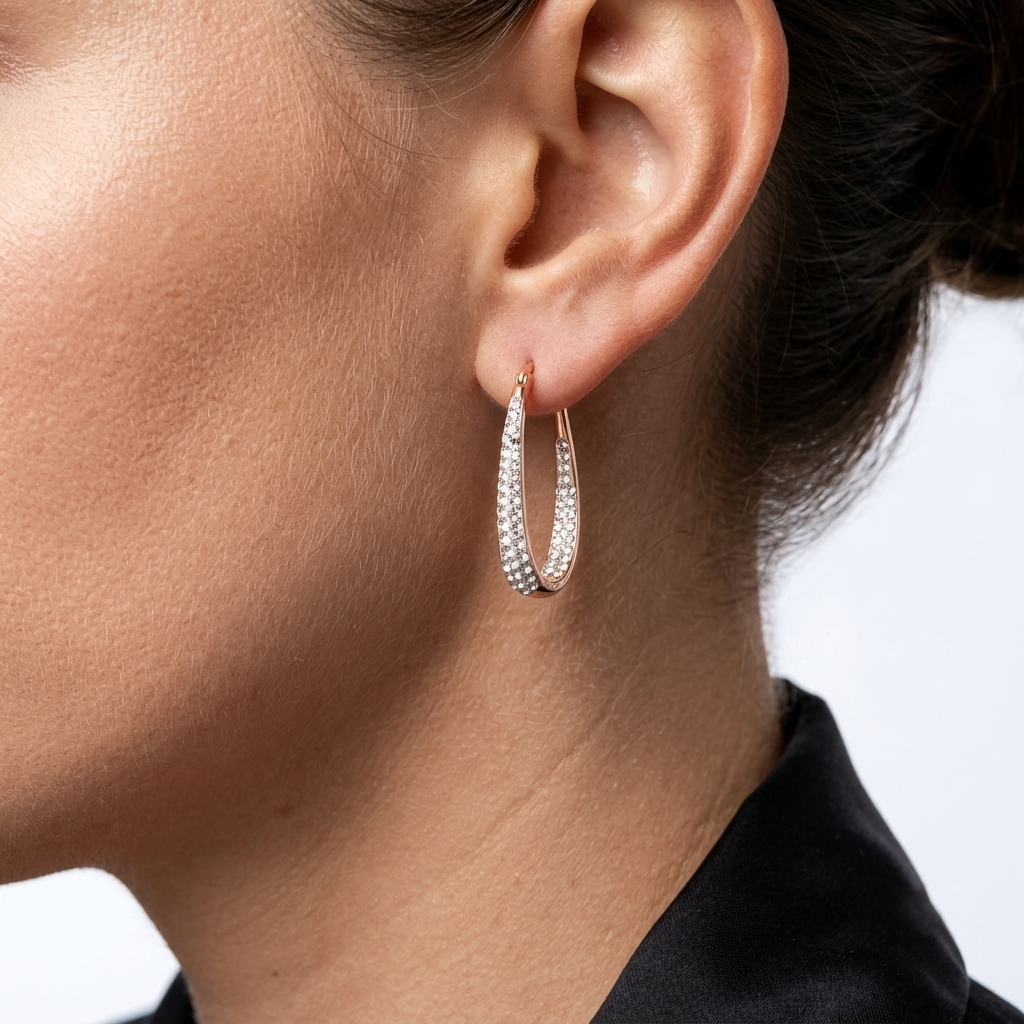 Model wearing rose gold crystal hoop earrings