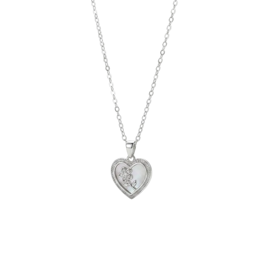 The Floral Heart Pendant in stainless steel, featuring a subtle Mother of Pearl inlay and stone-set flower design