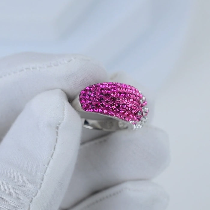 Video showing the fluid light reflection and the seamless, vibrant color transition across the crystals of the handcrafted Signature Fuchsia Ombré Dome ring
