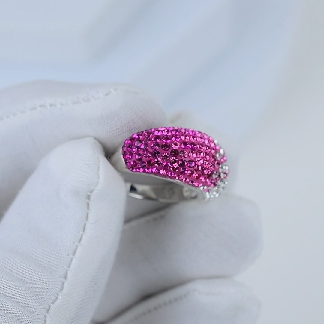 Video showing the fluid light reflection and the seamless, vibrant color transition across the crystals of the handcrafted Signature Fuchsia Ombré Dome ring