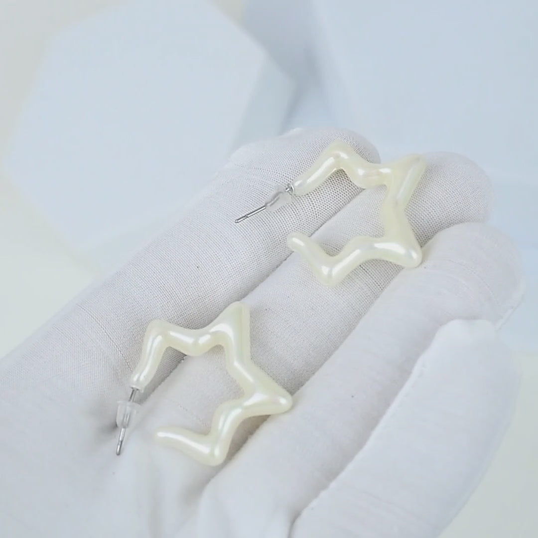 Glossy white star stud earrings for everyday styling by Civaro